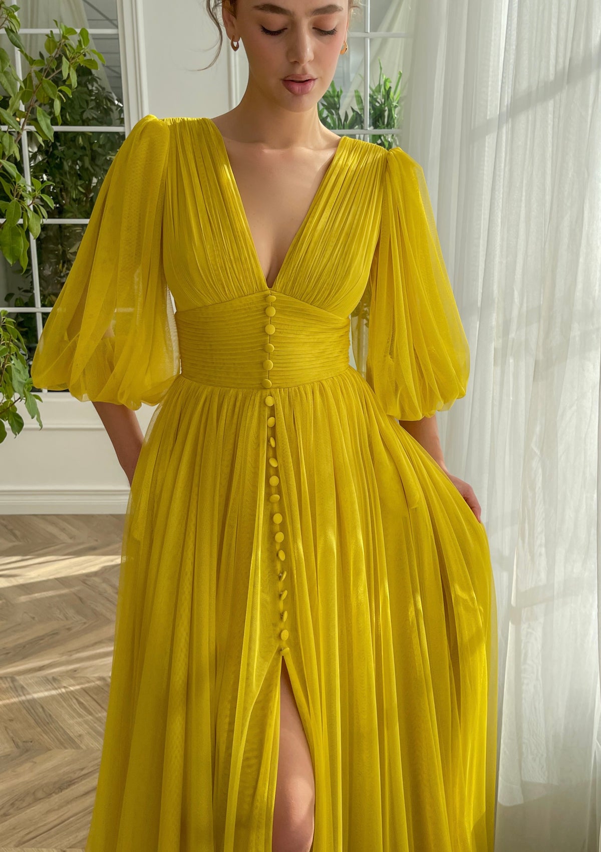Yellow A-Line dress with long sleeves and v-neck