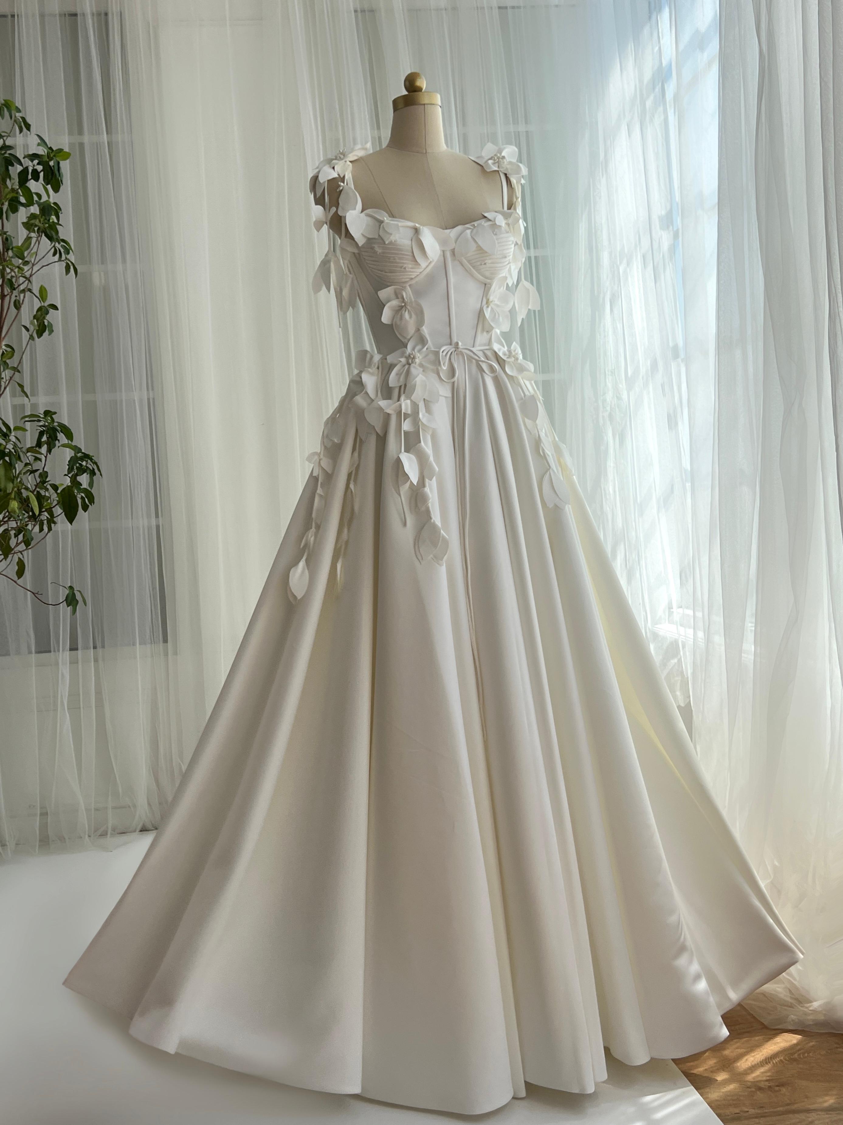 White bridal A-Line gown with straps and embroidered petals