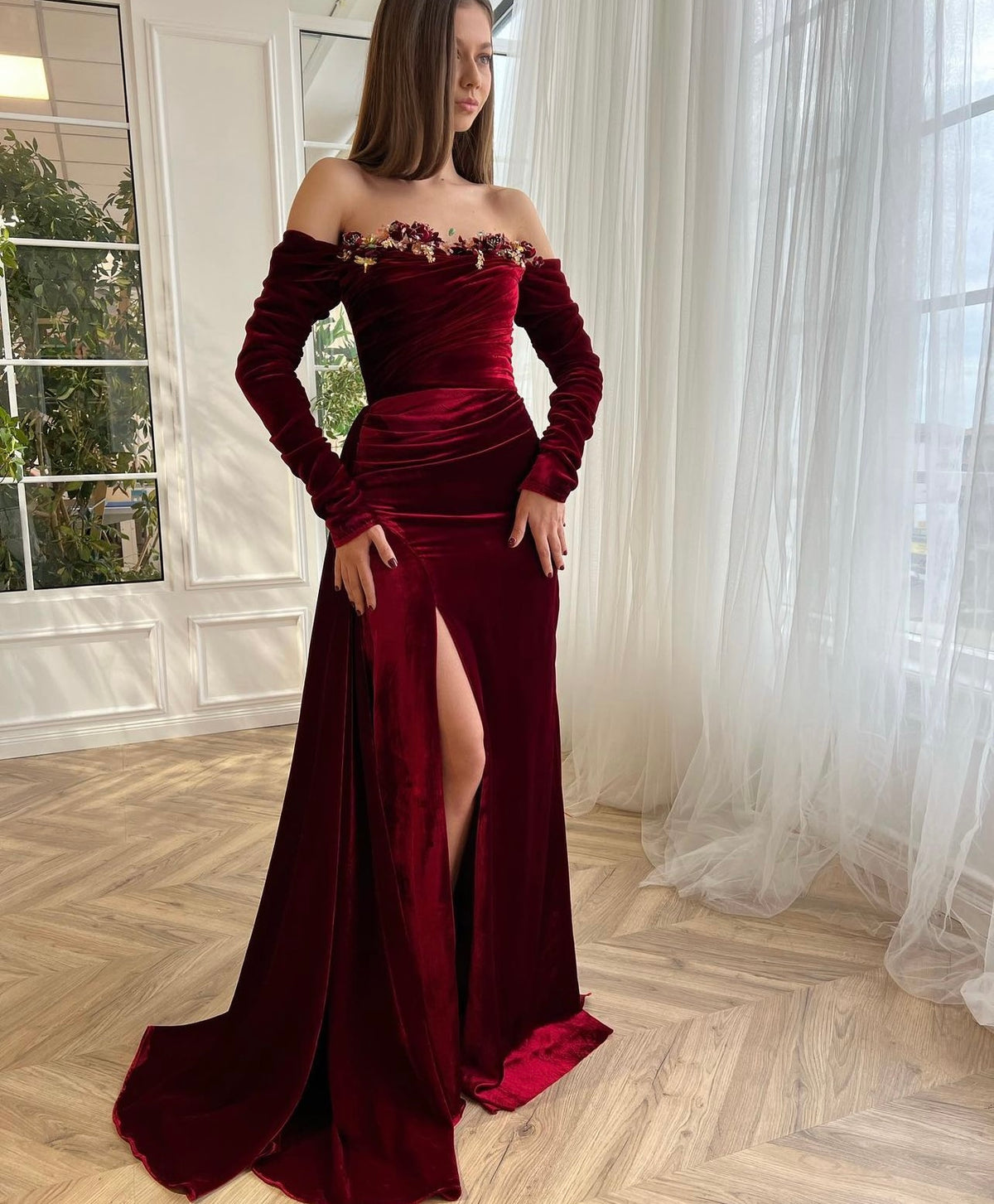 Red mermaid dress with long off the shoulder sleeves and embroidery