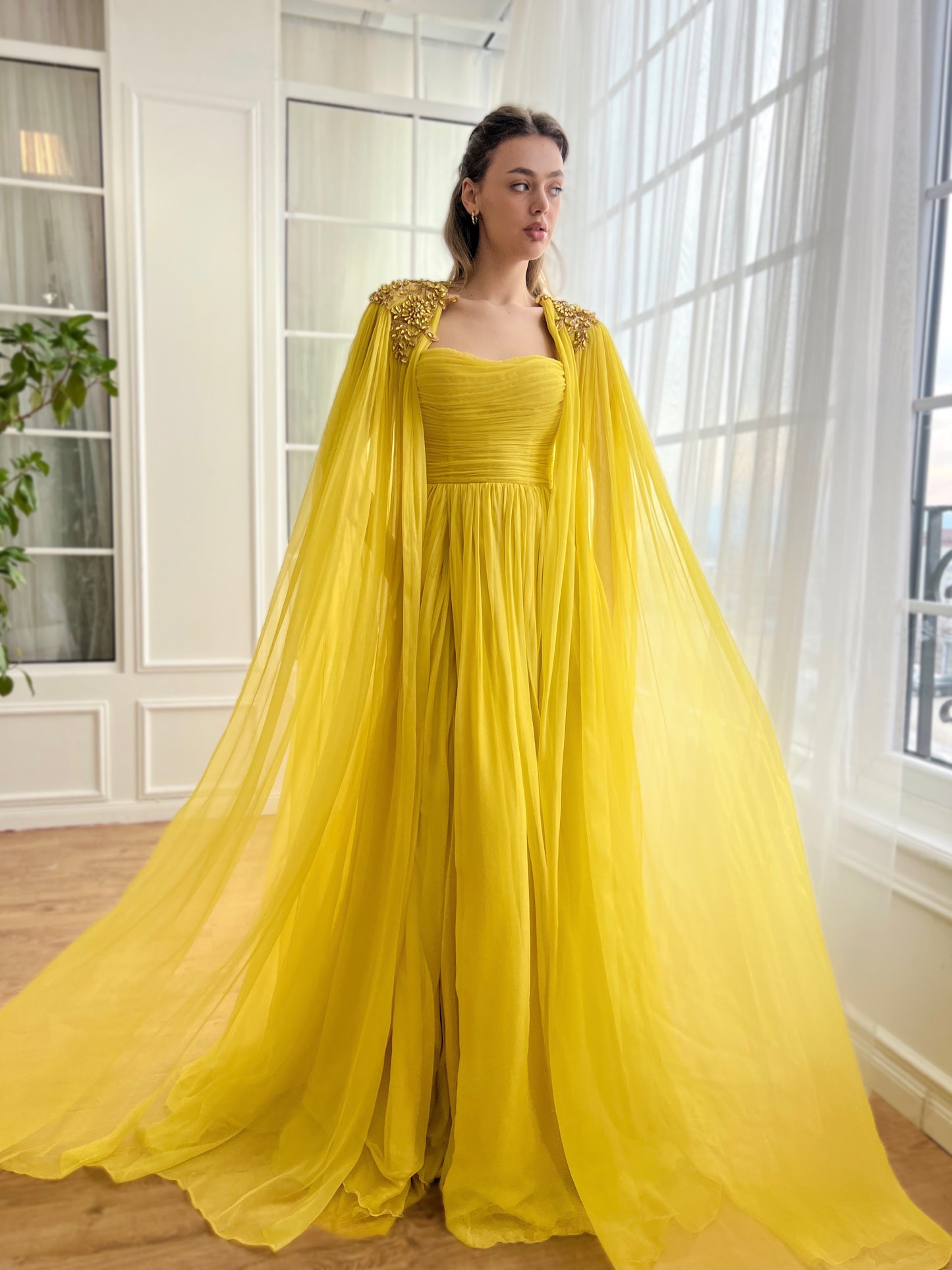 Yellow A-Line dress with embroidery and cape sleeves