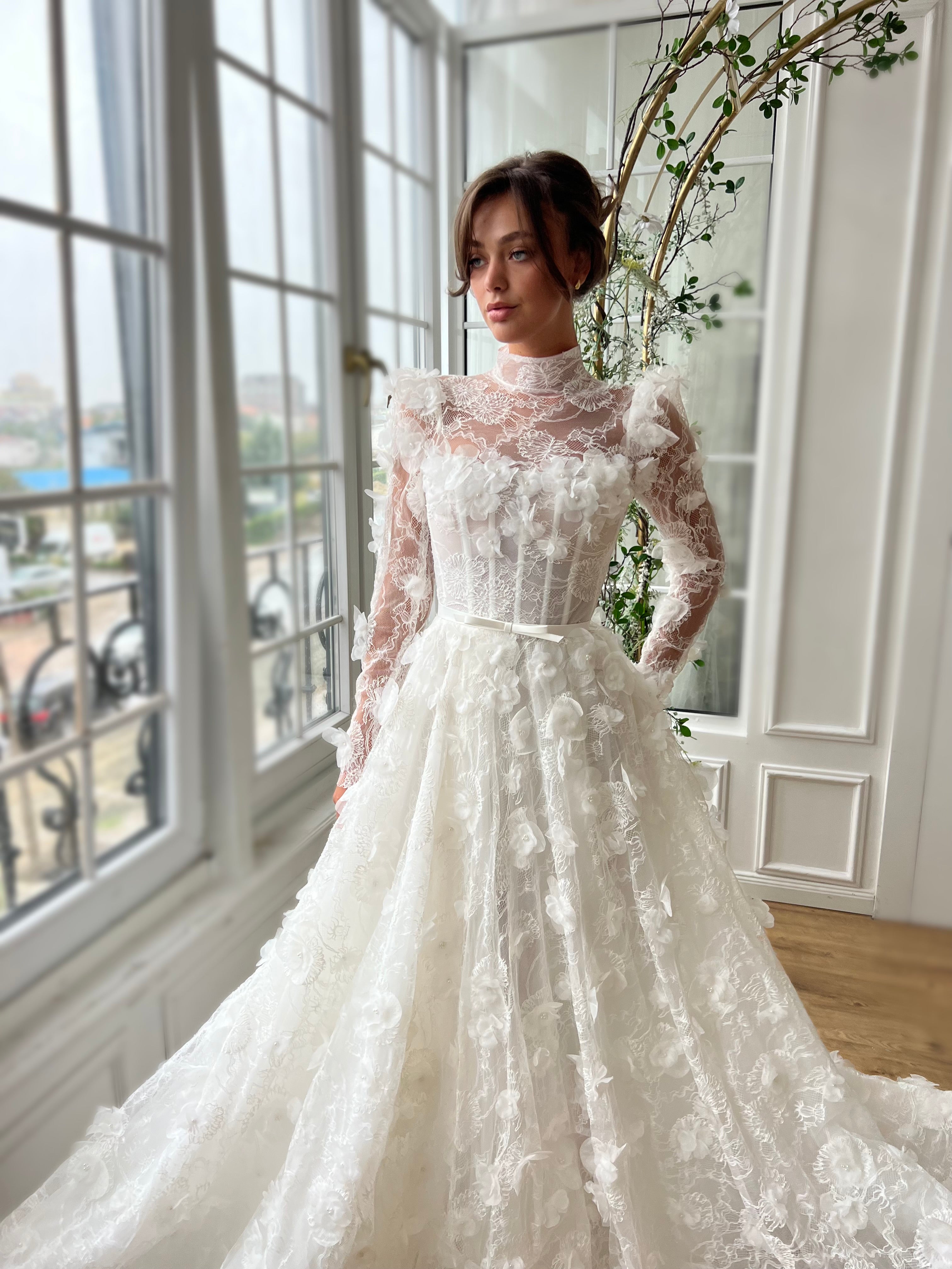White bridal A-Line gown with long sleeves and embroidery