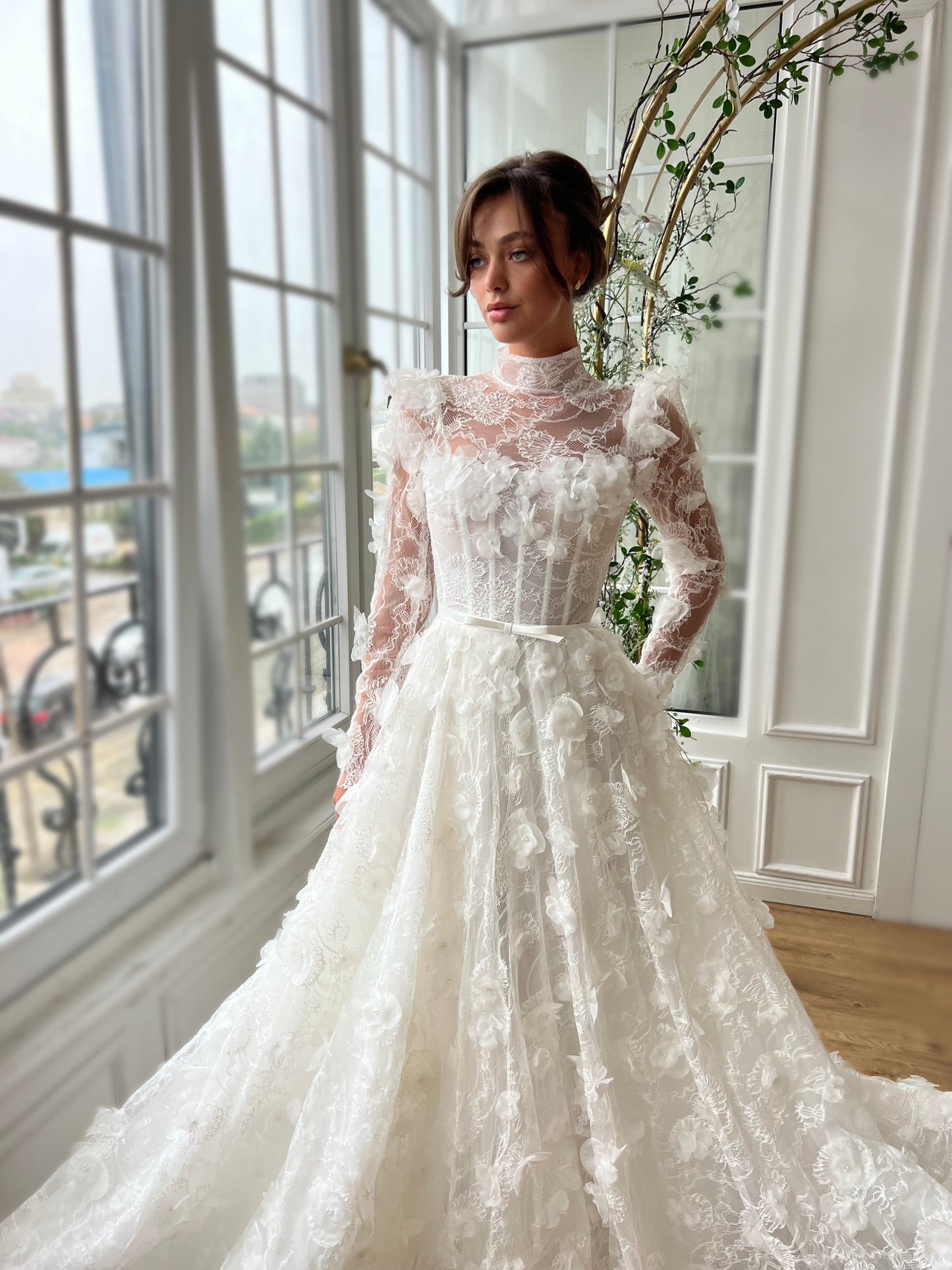 White bridal A-Line gown with long sleeves and embroidery