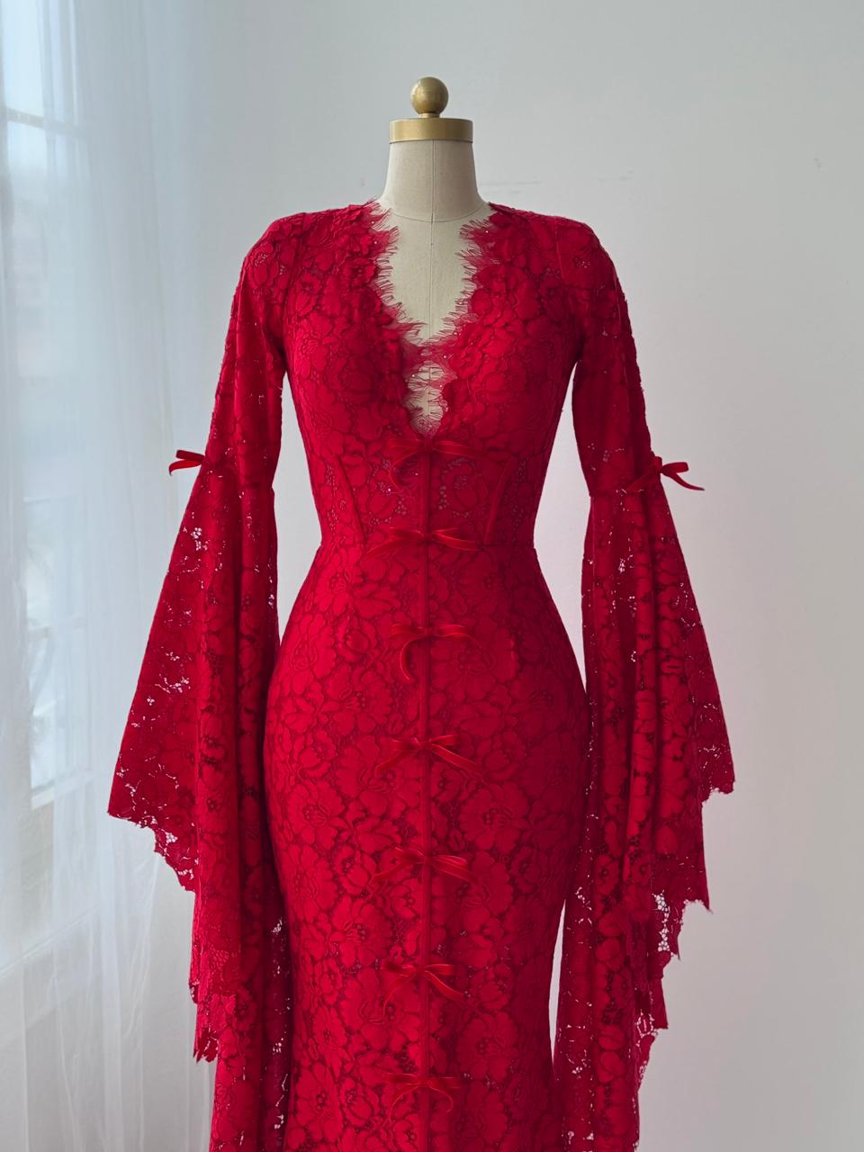 Red mermaid gown with lace, long sleeves, embroidered bows and v-neck