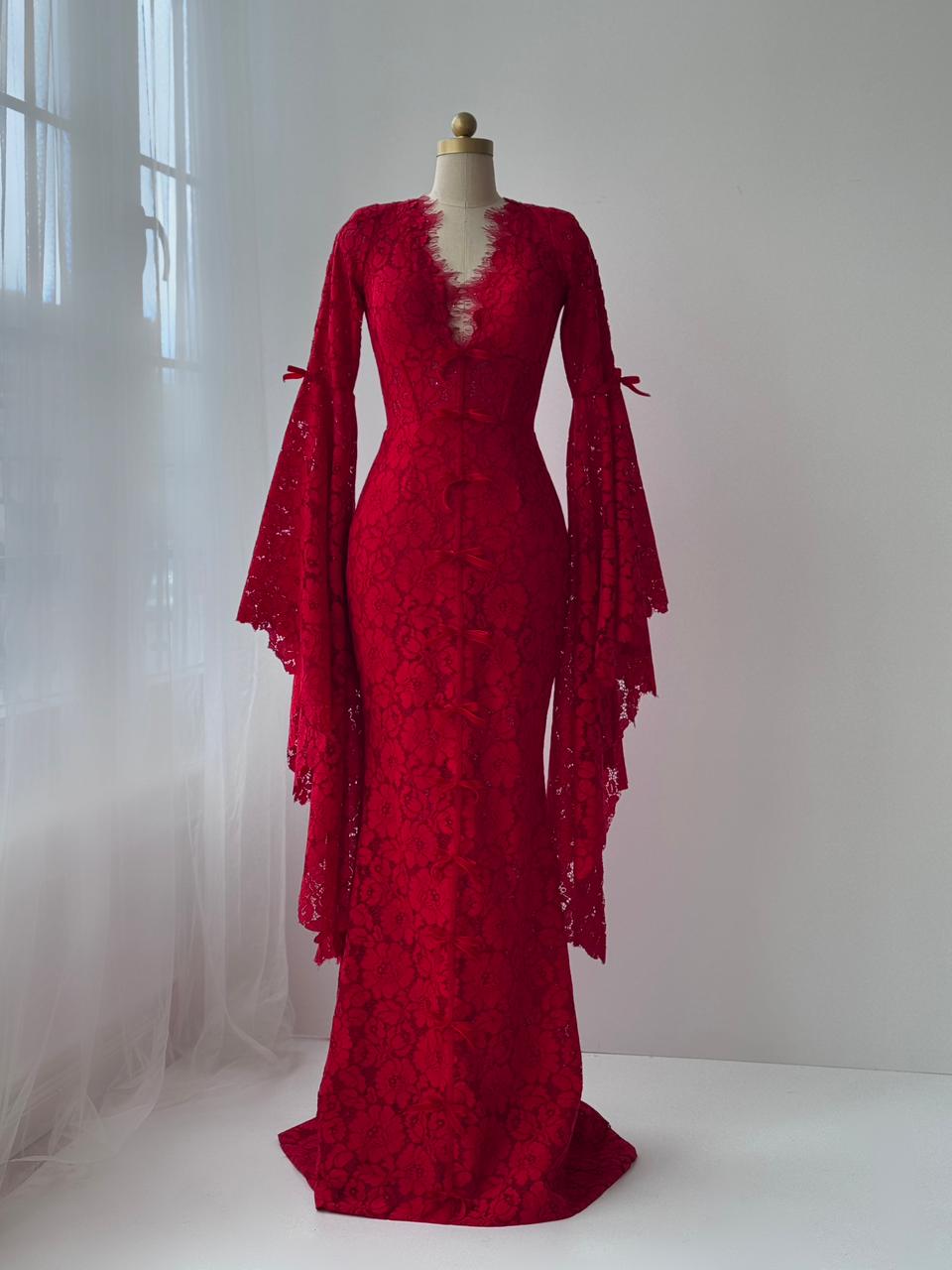 Red mermaid gown with lace, long sleeves, embroidered bows and v-neck