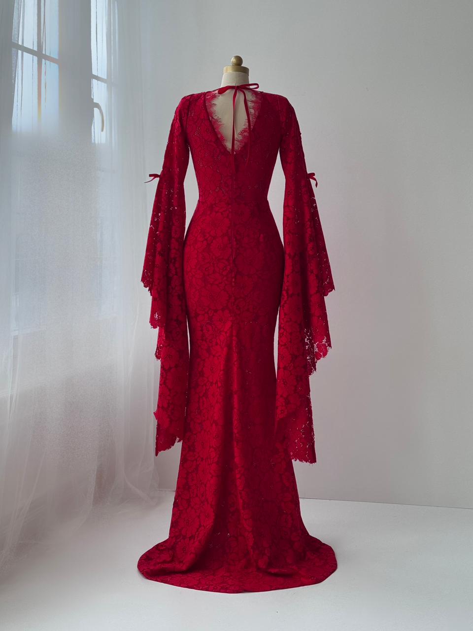 Red mermaid gown with lace, long sleeves, embroidered bows and v-neck
