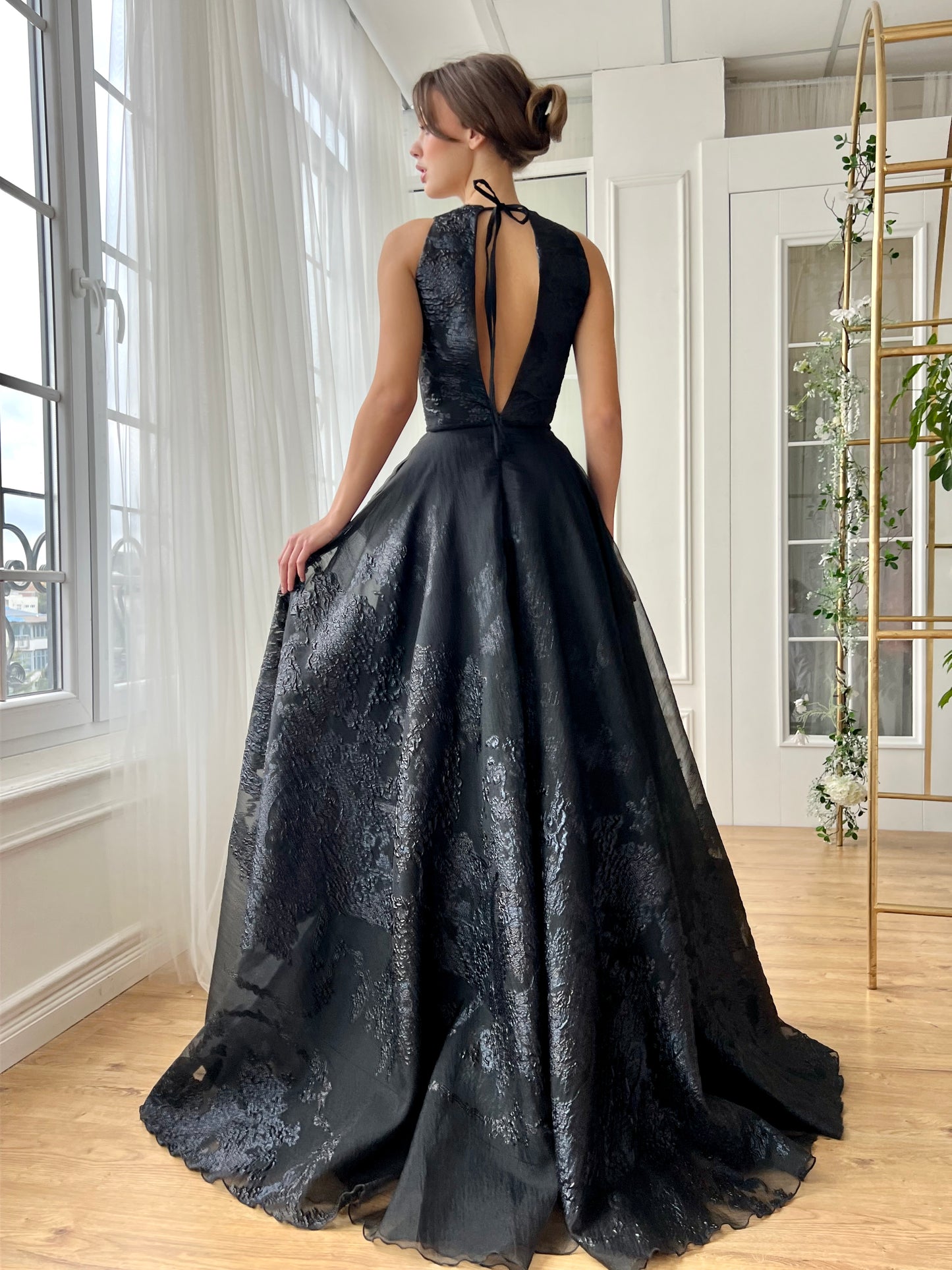 Black A-Line gown with v-neck and without sleeves