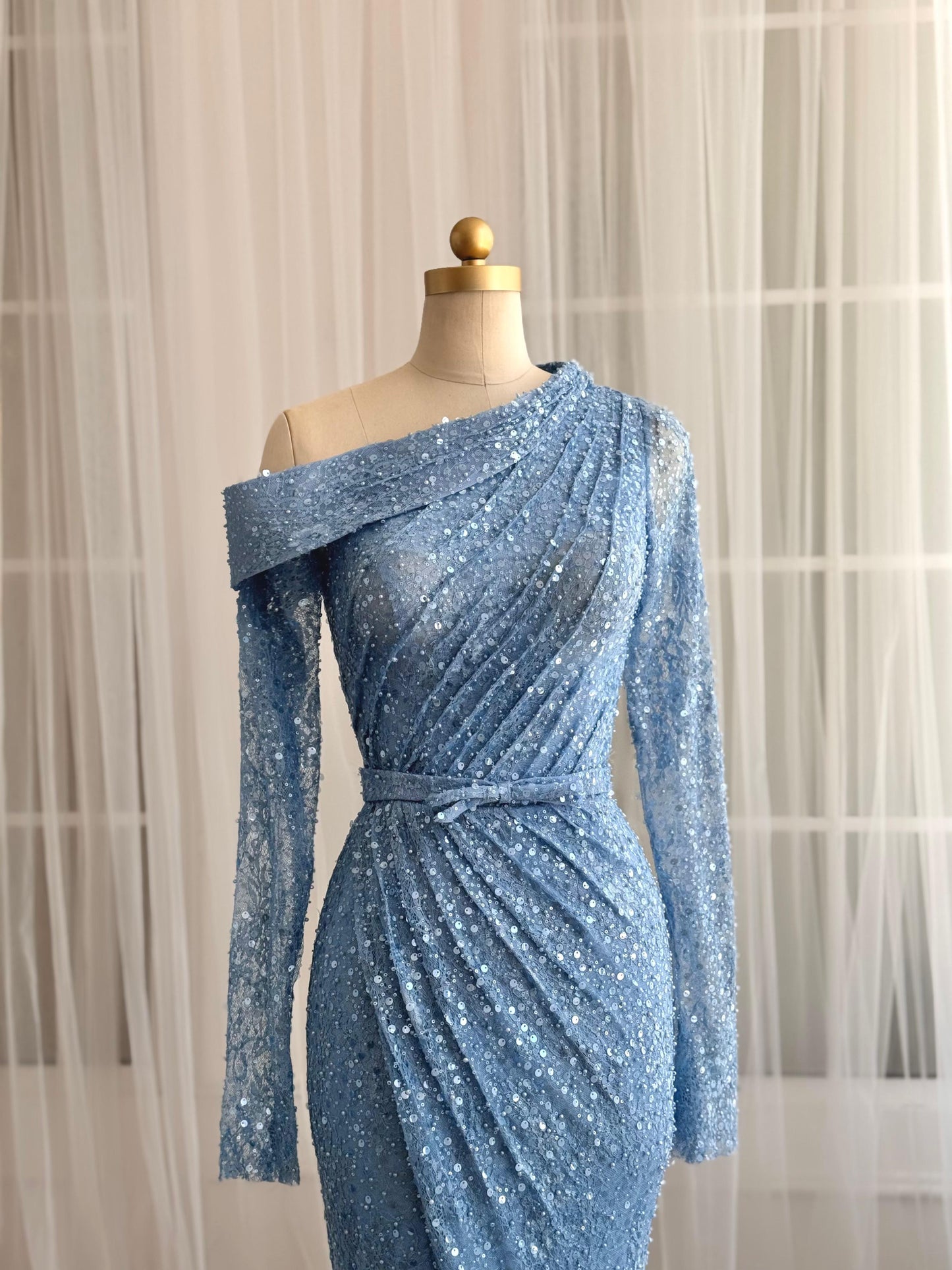 Blue mermaid dress with long sleeves and sequin fabric