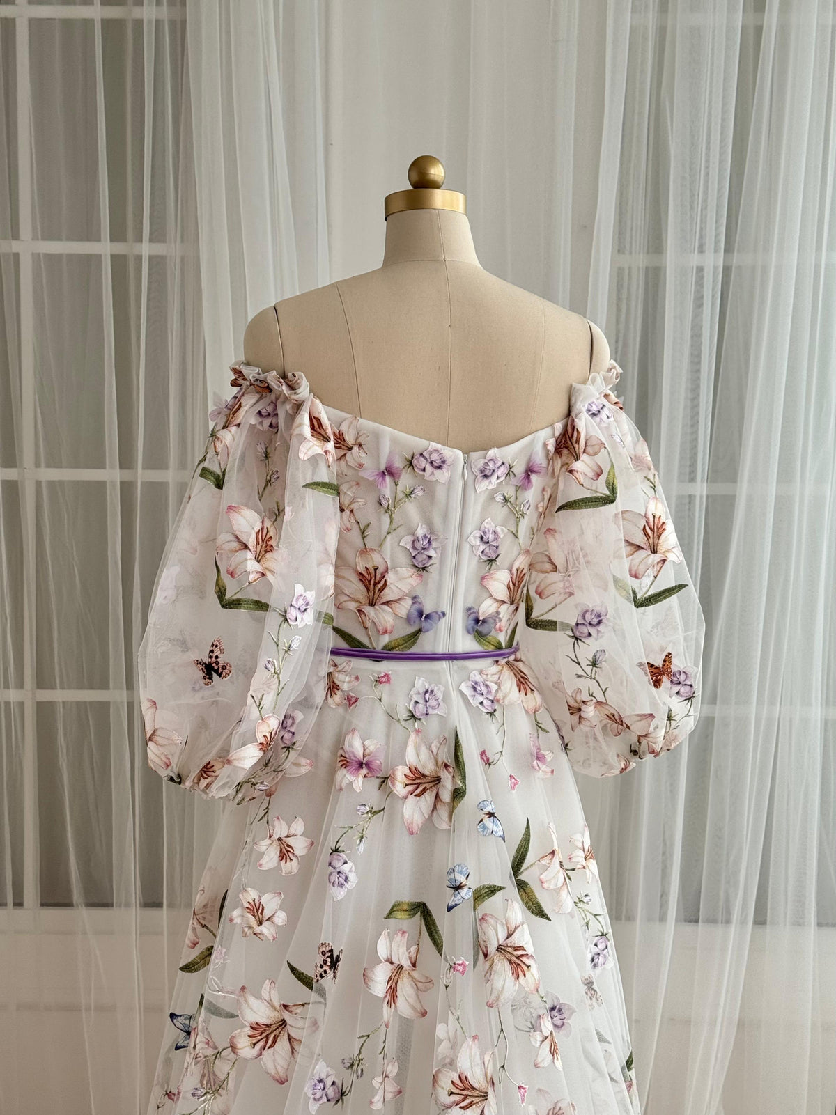 White A-Line dress with floral embroidery and long off the shoulder sleeves