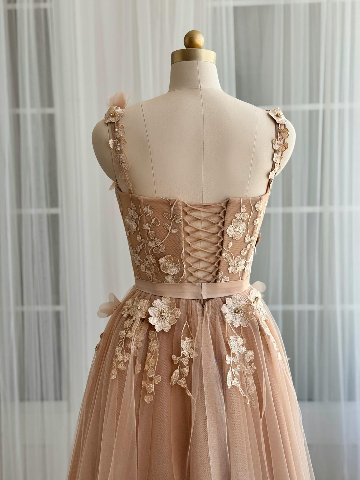 Beige midi dress with embroidered flowers and straps