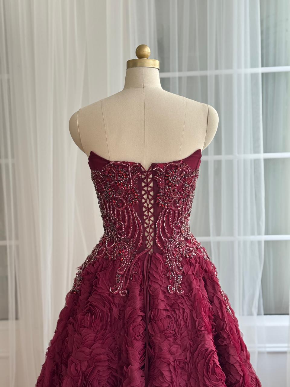 Burgundy A-Line gown with ruffled skirt, embroidery and no sleeves