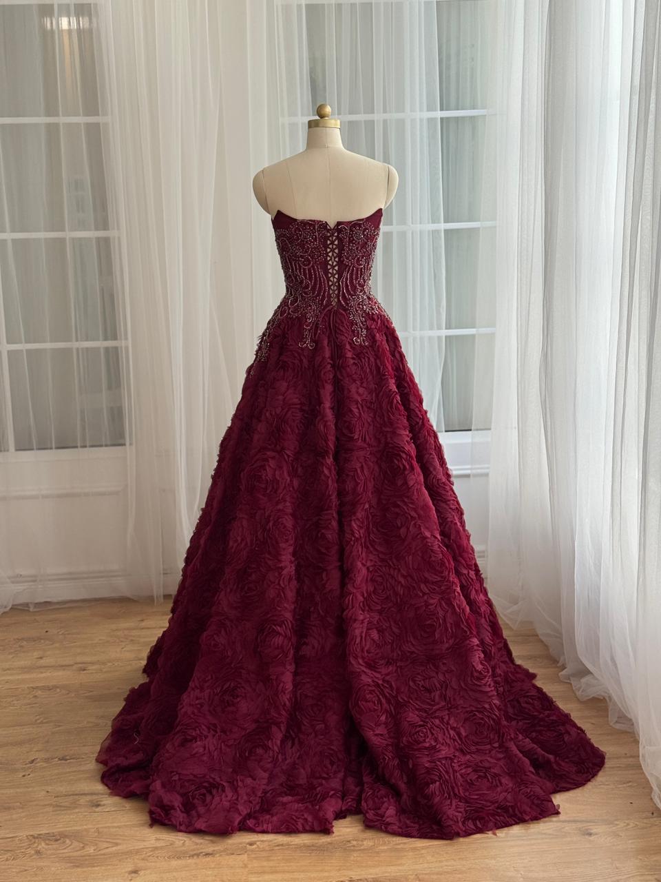 Burgundy A-Line gown with ruffled skirt, embroidery and no sleeves