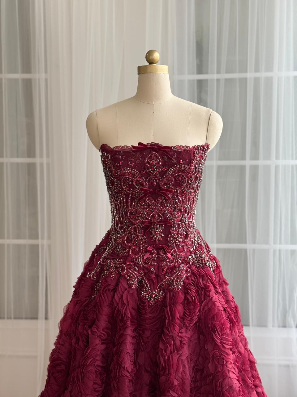 Burgundy A-Line gown with ruffled skirt, embroidery and no sleeves