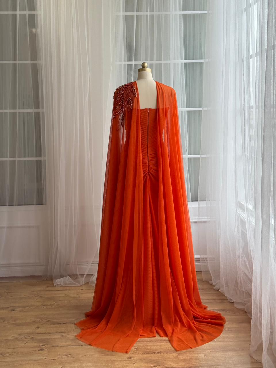 Orange mermaid dress with embroidery, cape and no sleeves
