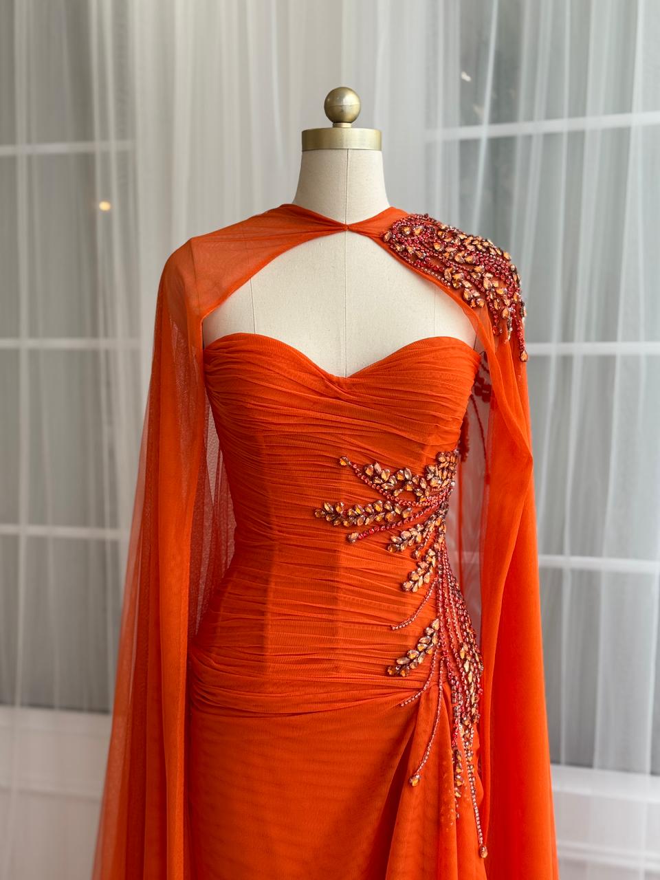 Orange mermaid dress with embroidery, cape and no sleeves