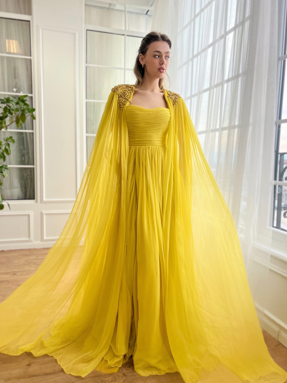 Yellow A-Line dress with embroidery and cape sleeves