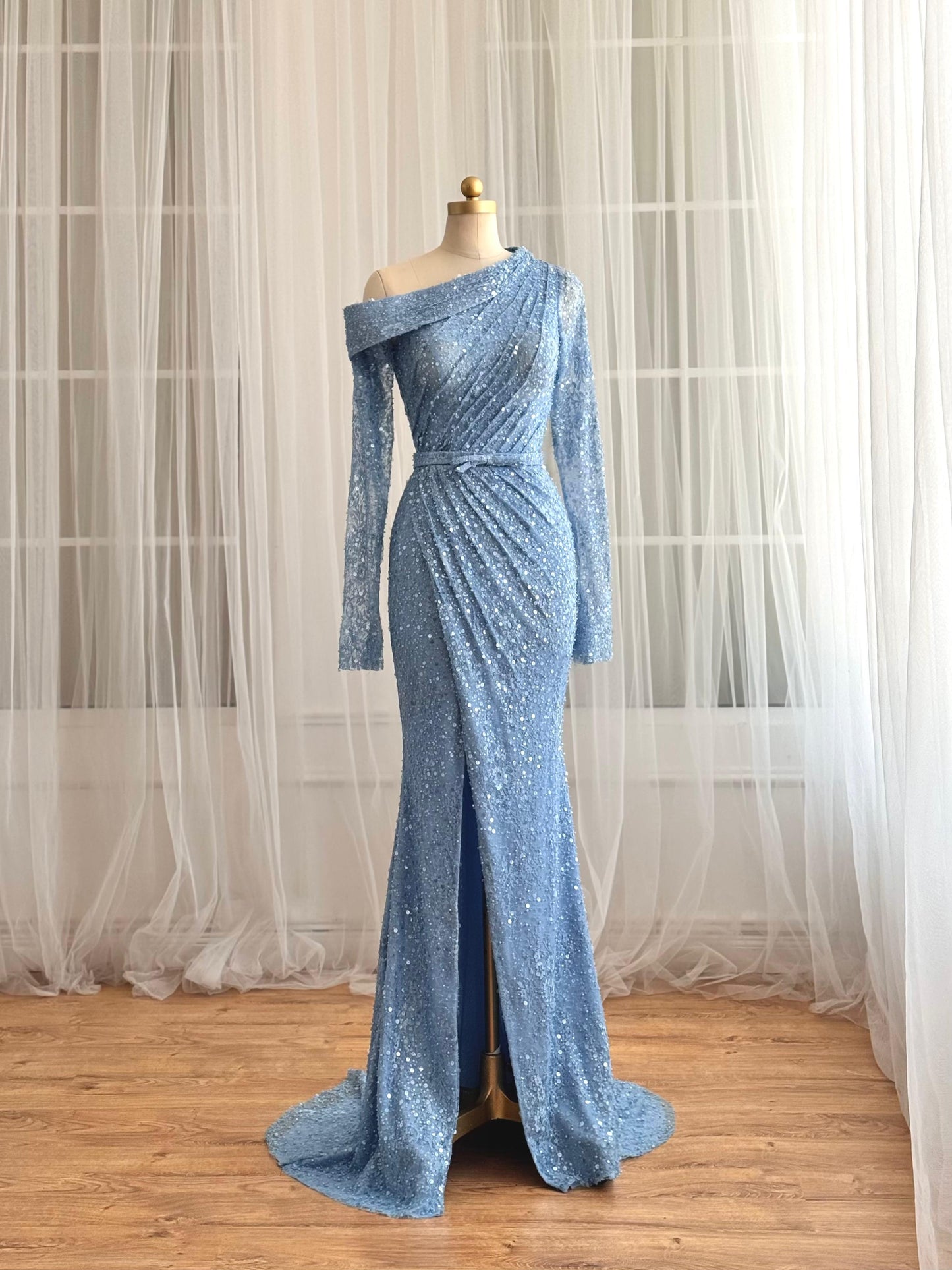 Blue mermaid dress with long sleeves and sequin fabric