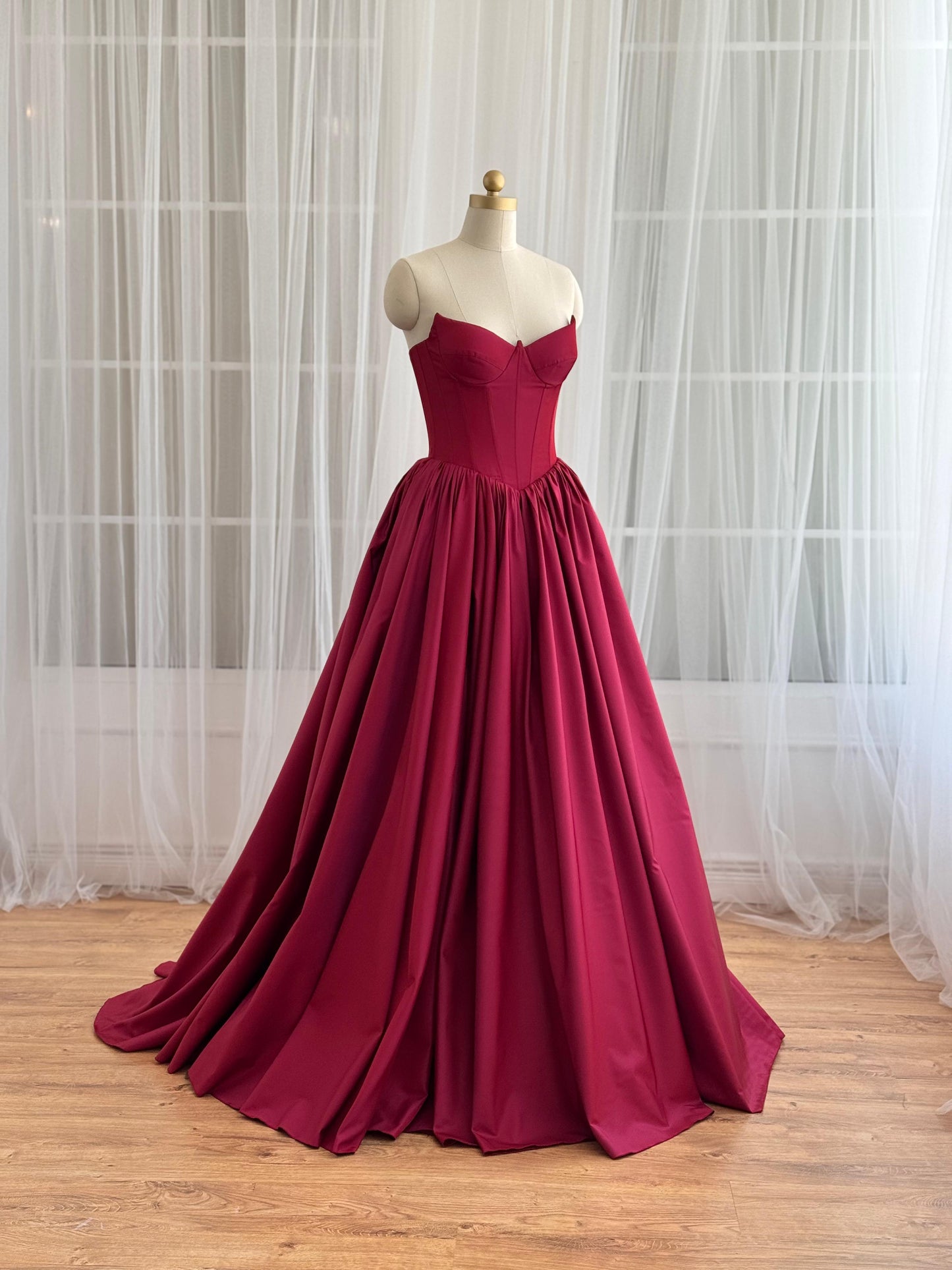 Red A-Line gown with no sleeves and taffeta fabric