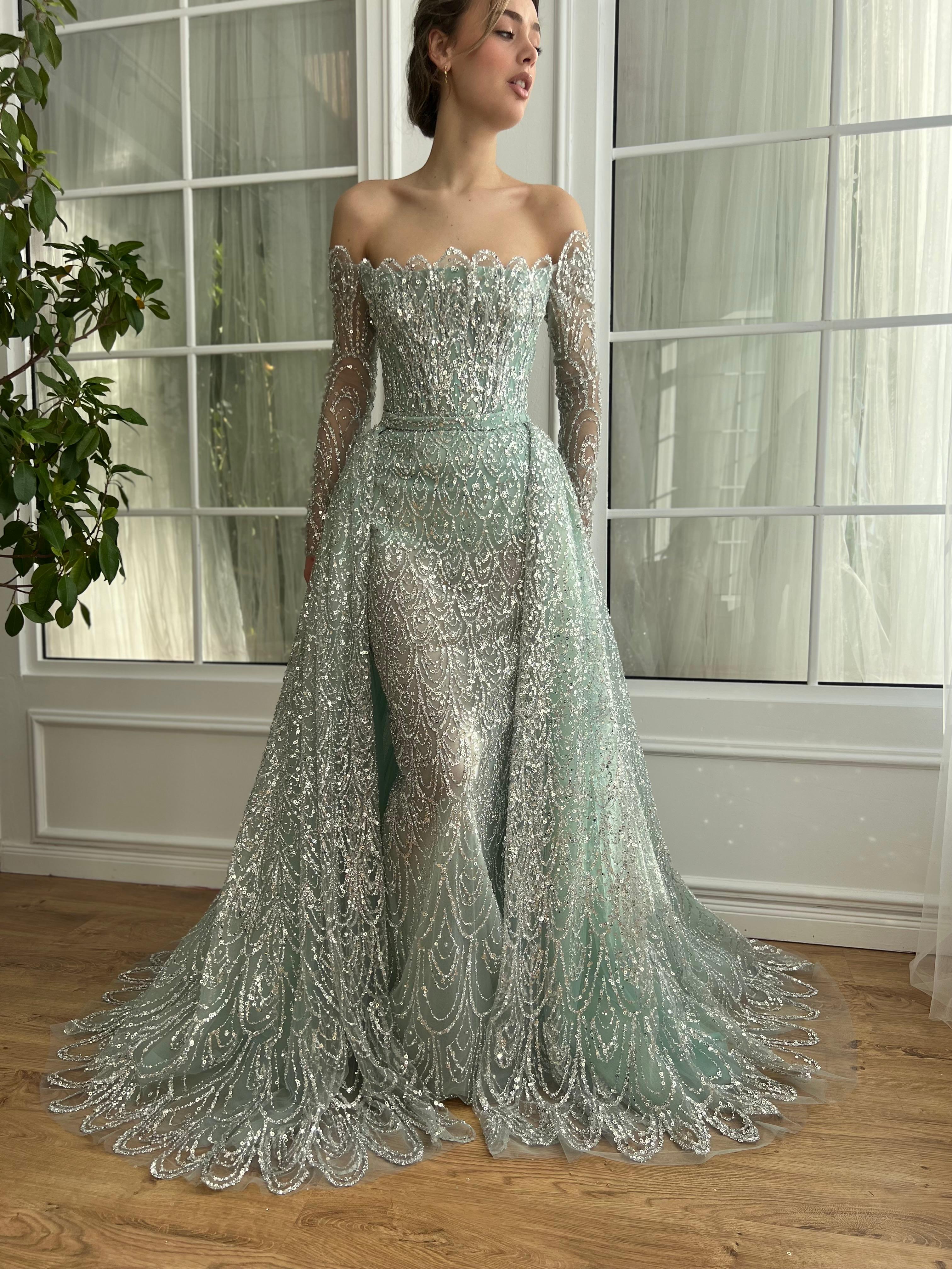 Mint A-Line dress with overskirt, long off the shoulder sleeves, embroidery and sequins