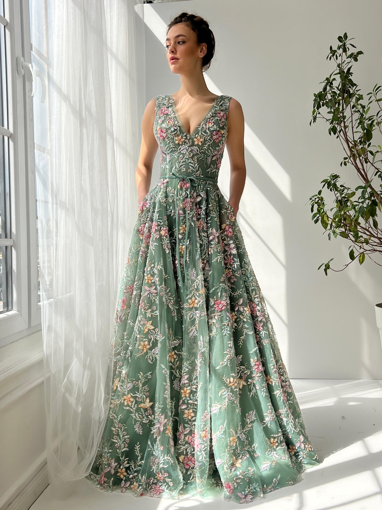 Green A-Line dress with v-neck, embroidery and no sleeves