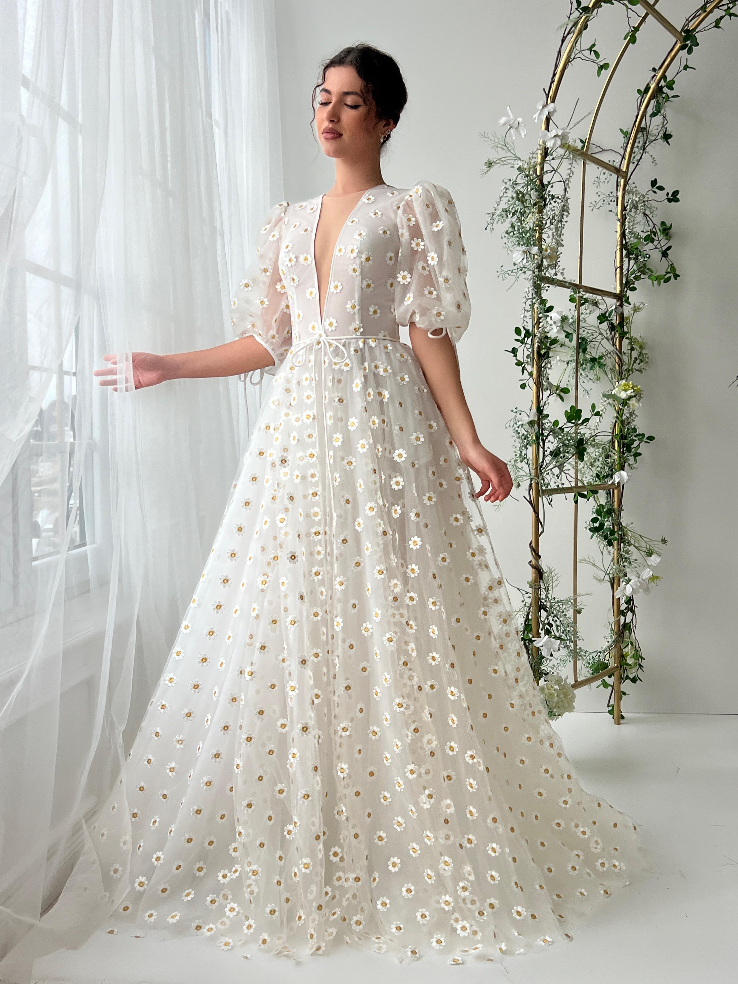 White A-Line dress with short sleeves, v-neck and daisies