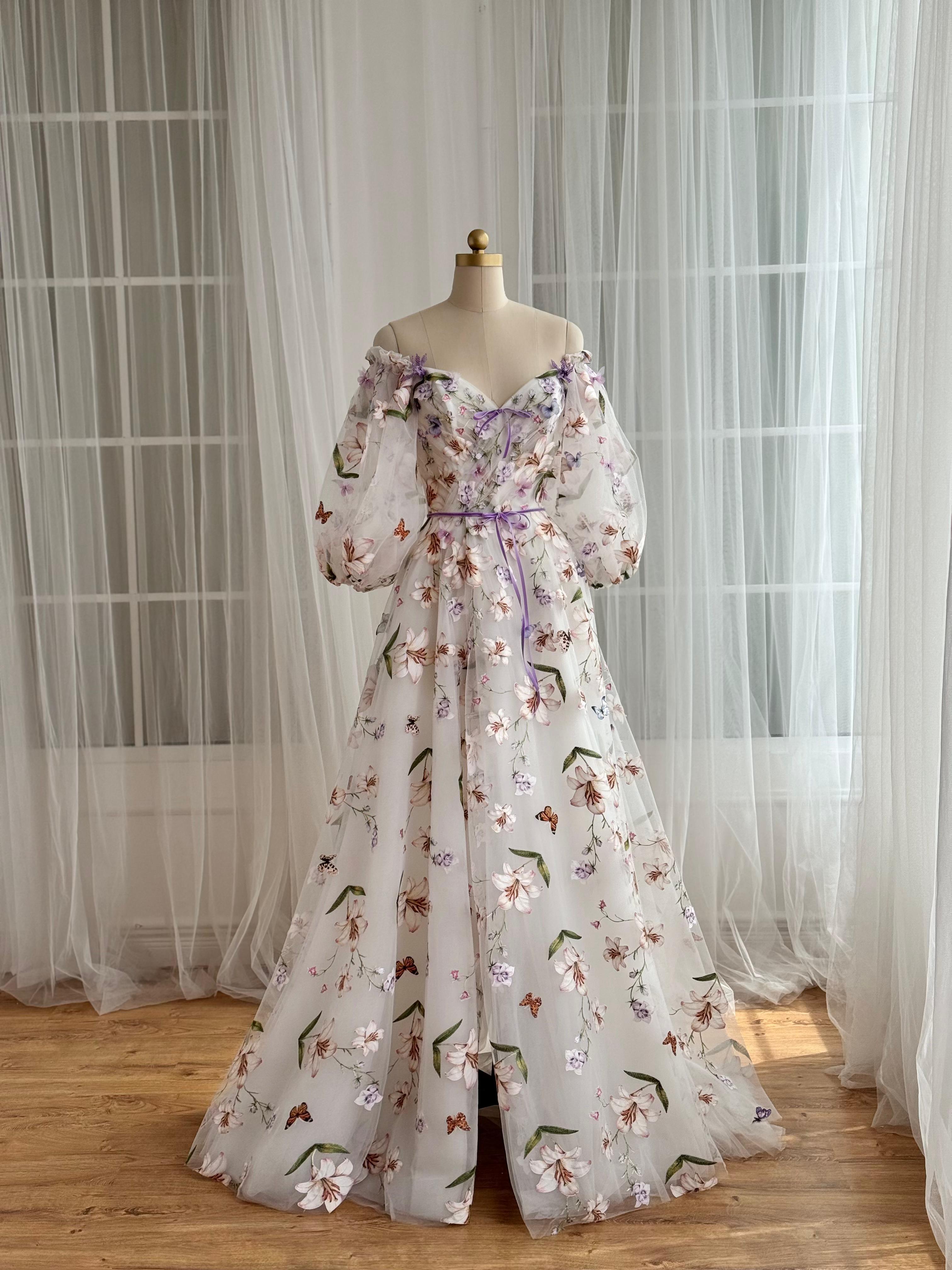 White A-Line dress with floral embroidery and long off the shoulder sleeves