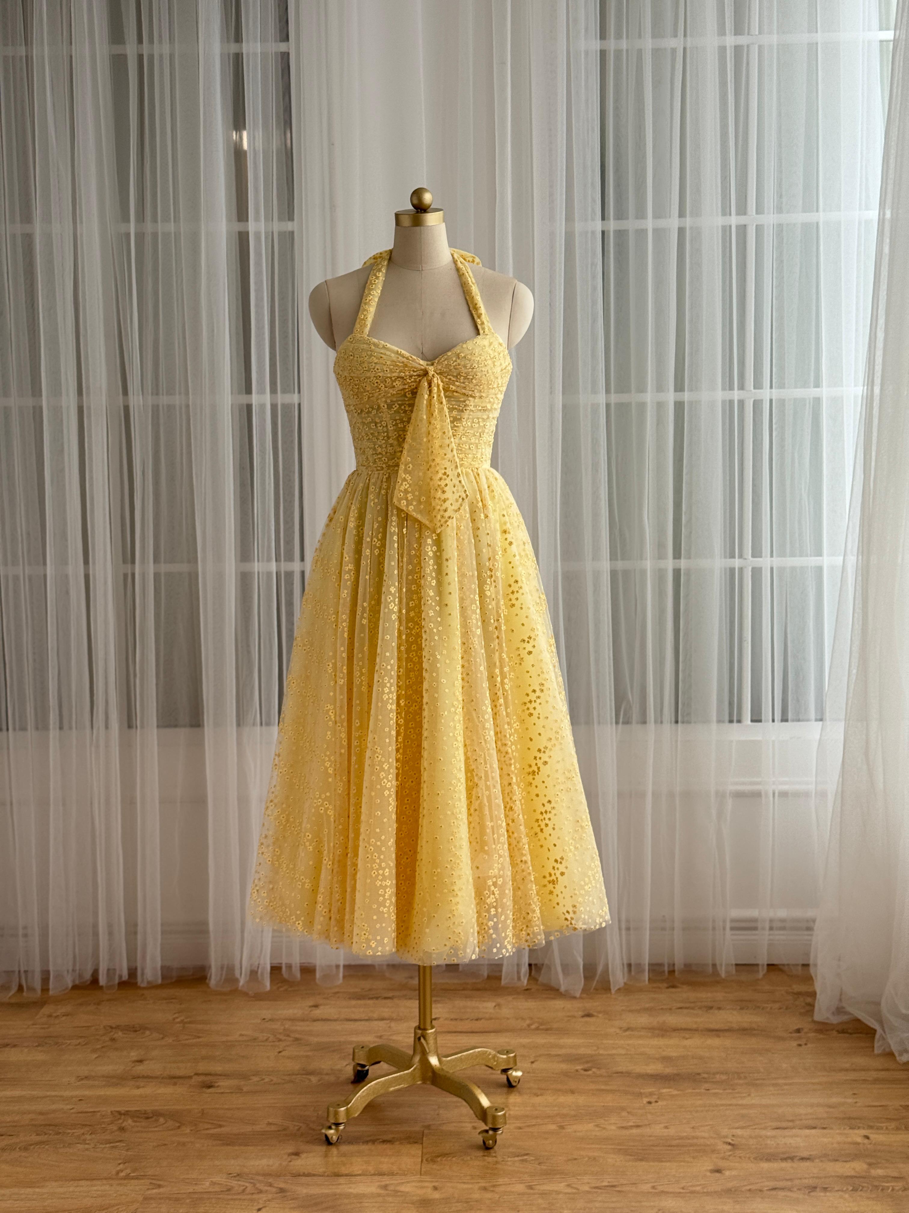 Yellow midi dress with straps and embroidered bow
