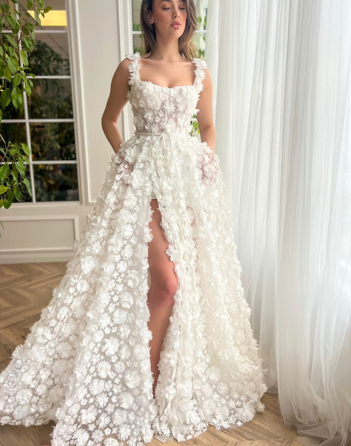 White A-Line bridal dress with spaghetti straps, lace and embroidery