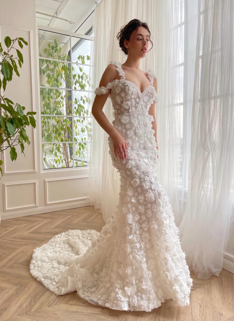 White mermaid bridal dress with off the shoulder sleeves, spaghetti straps, lace and embroidery