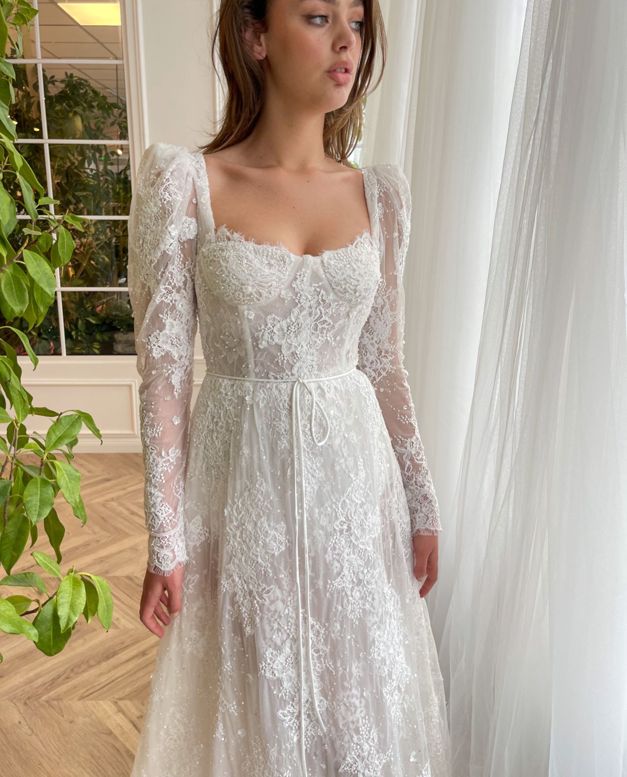 White A-Line bridal dress with long sleeves, lace and embroidery