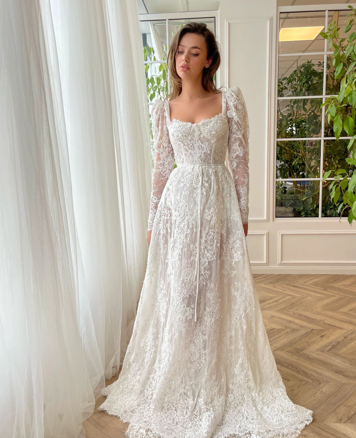 White A-Line bridal dress with long sleeves, lace and embroidery