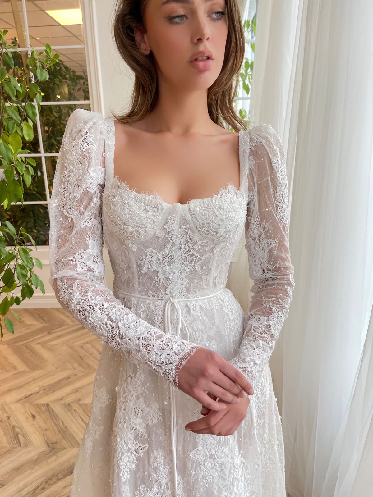 White A-Line bridal dress with long sleeves, lace and embroidery