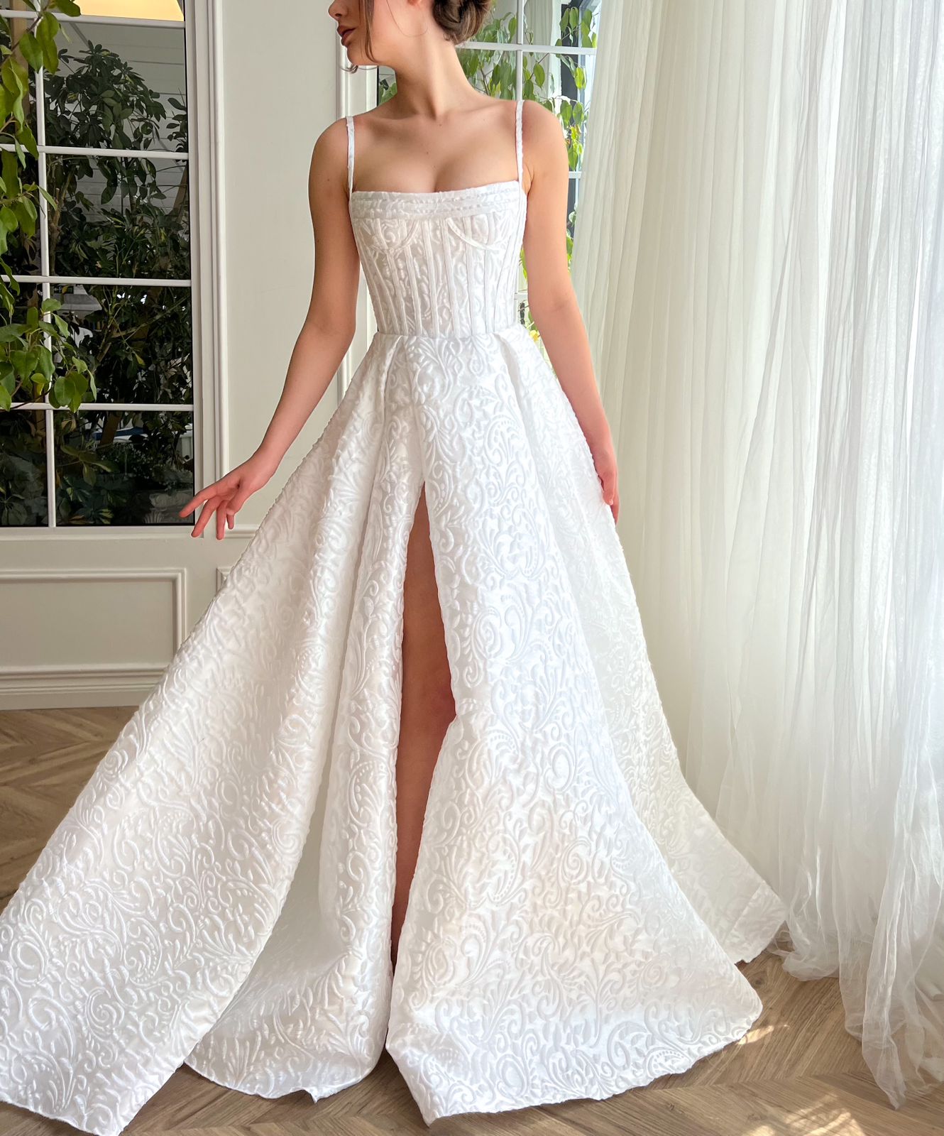 White A-Line bridal dress with spaghetti straps