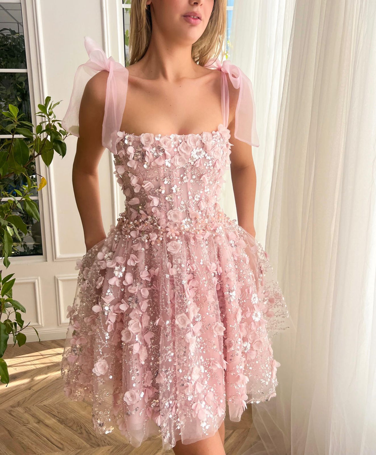 Pink mini dress with bow straps and embroidery