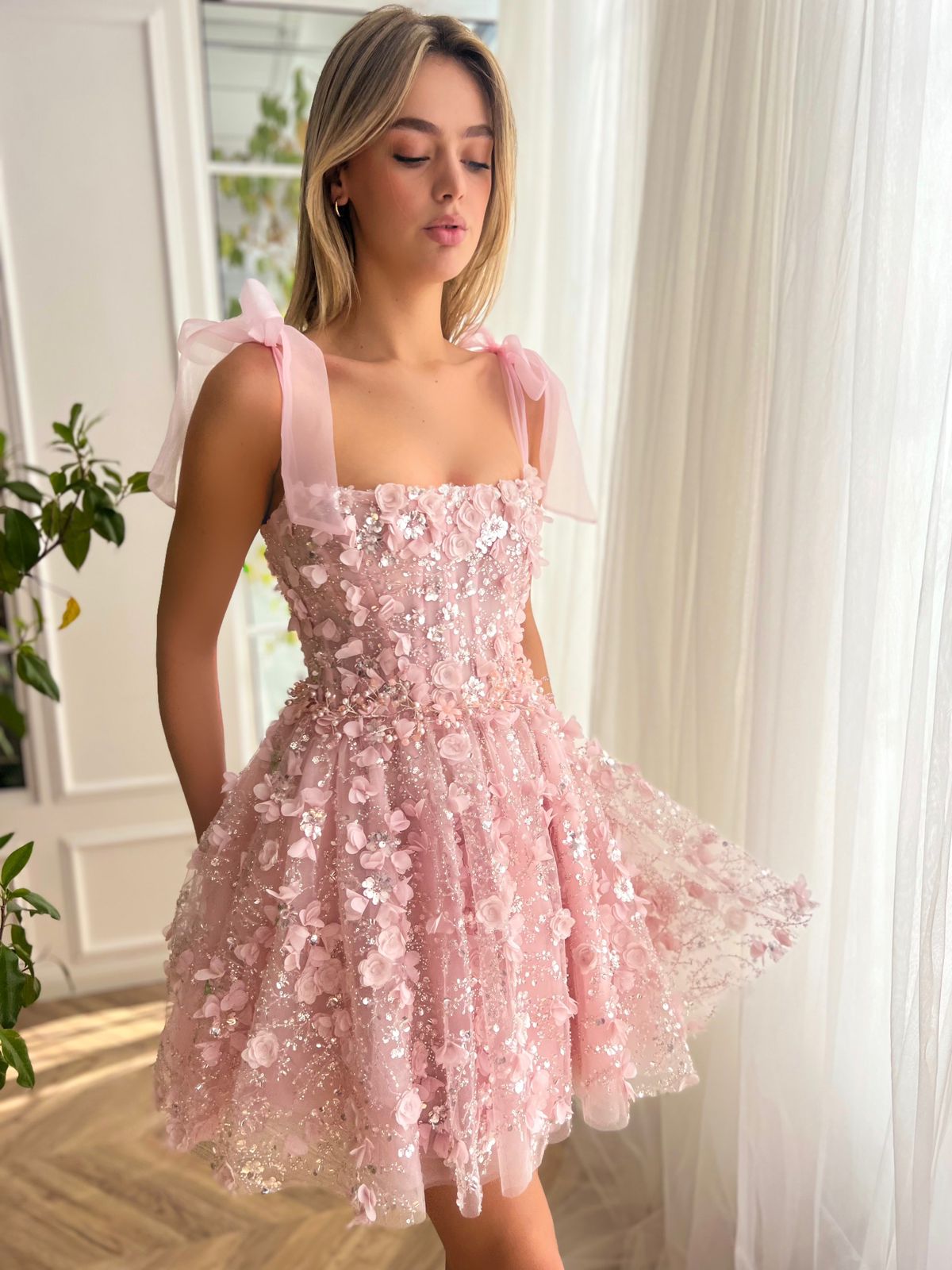 Pink mini dress with bow straps and embroidery