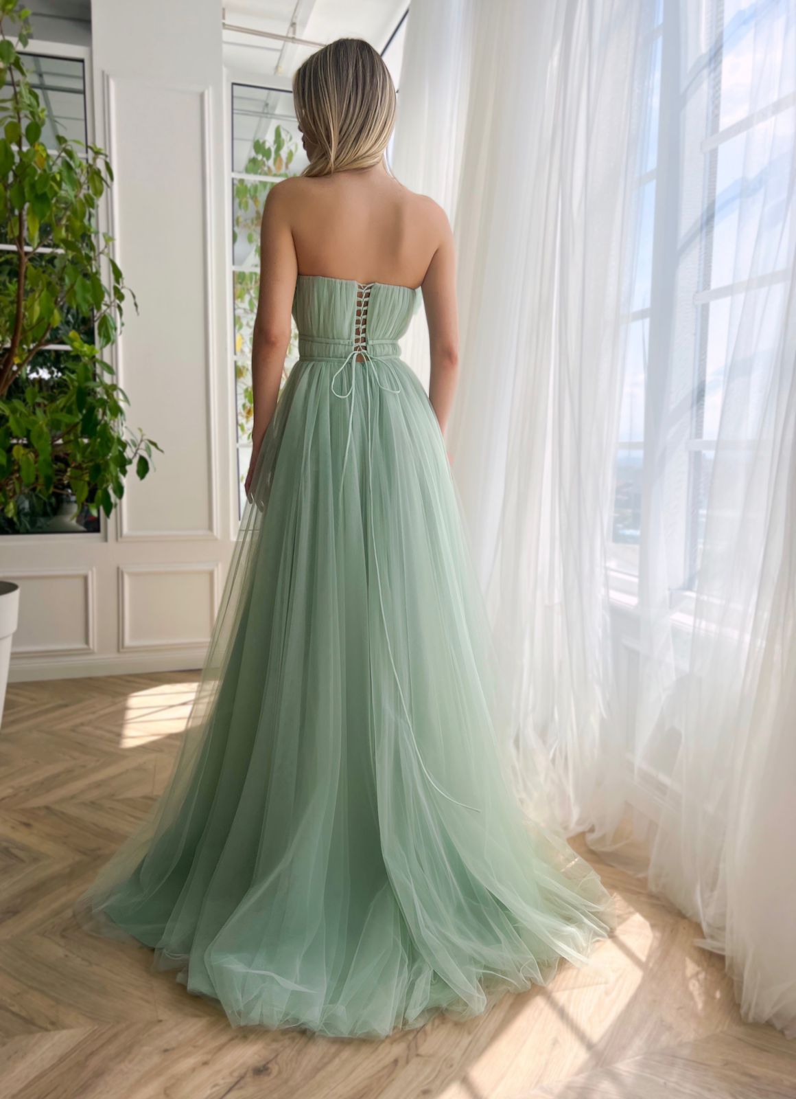 Green A-Line dress without sleeves and with embroidery