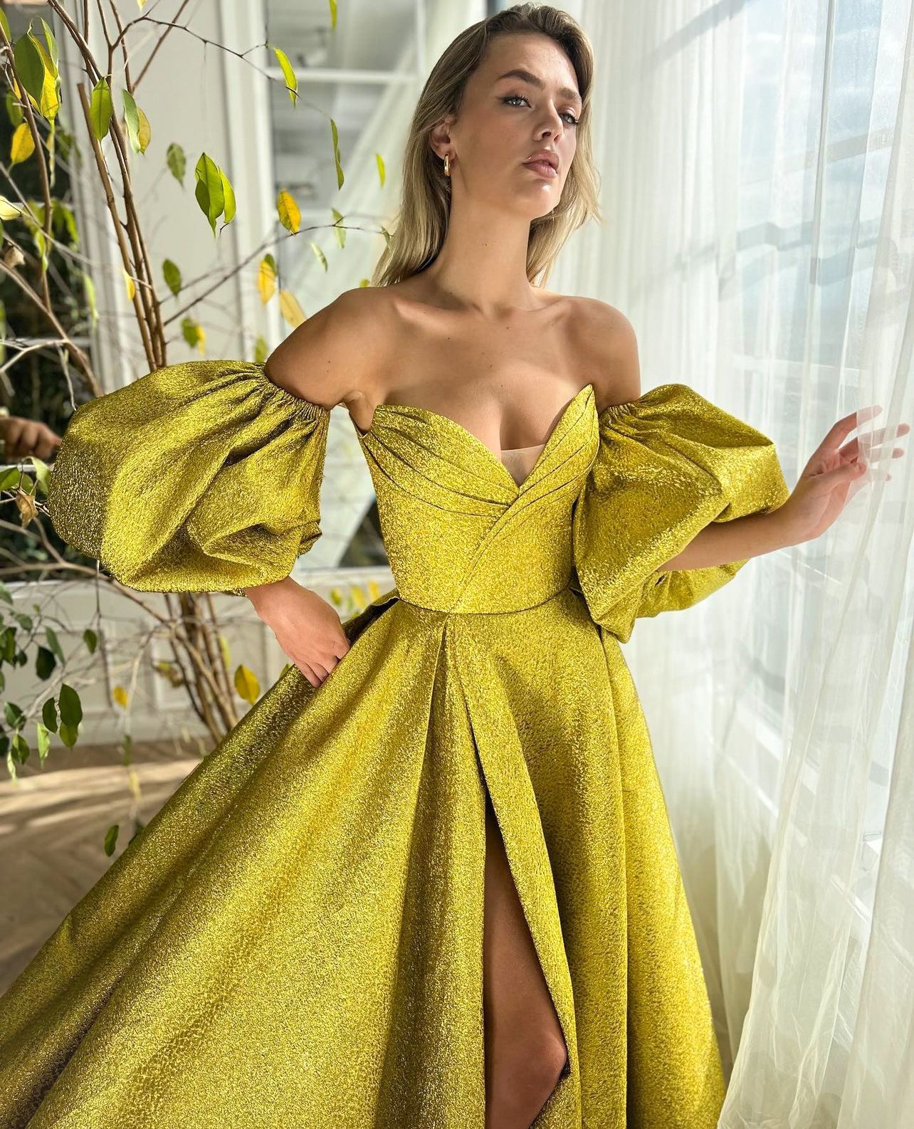 Yellow A-Line dress with short off the shoulder sleeves and shiny fabric