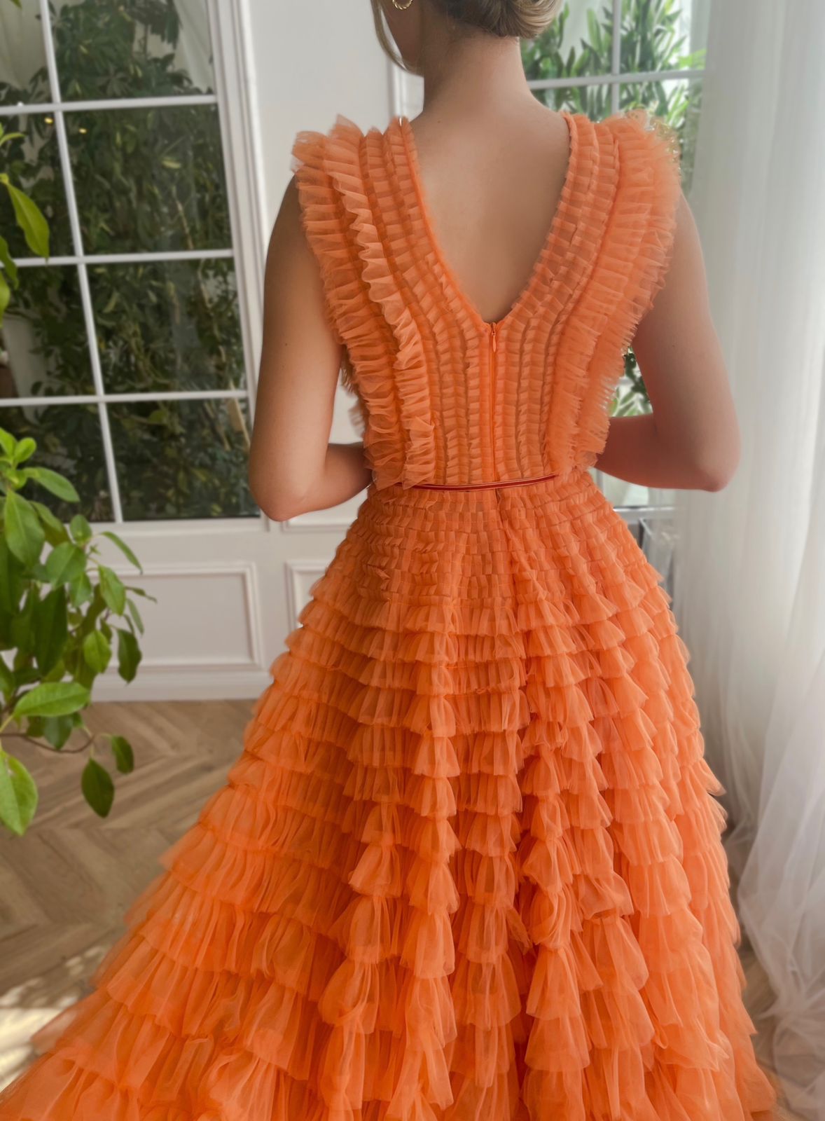Orange A-Line dress with ruffles, no sleeves and v-neck