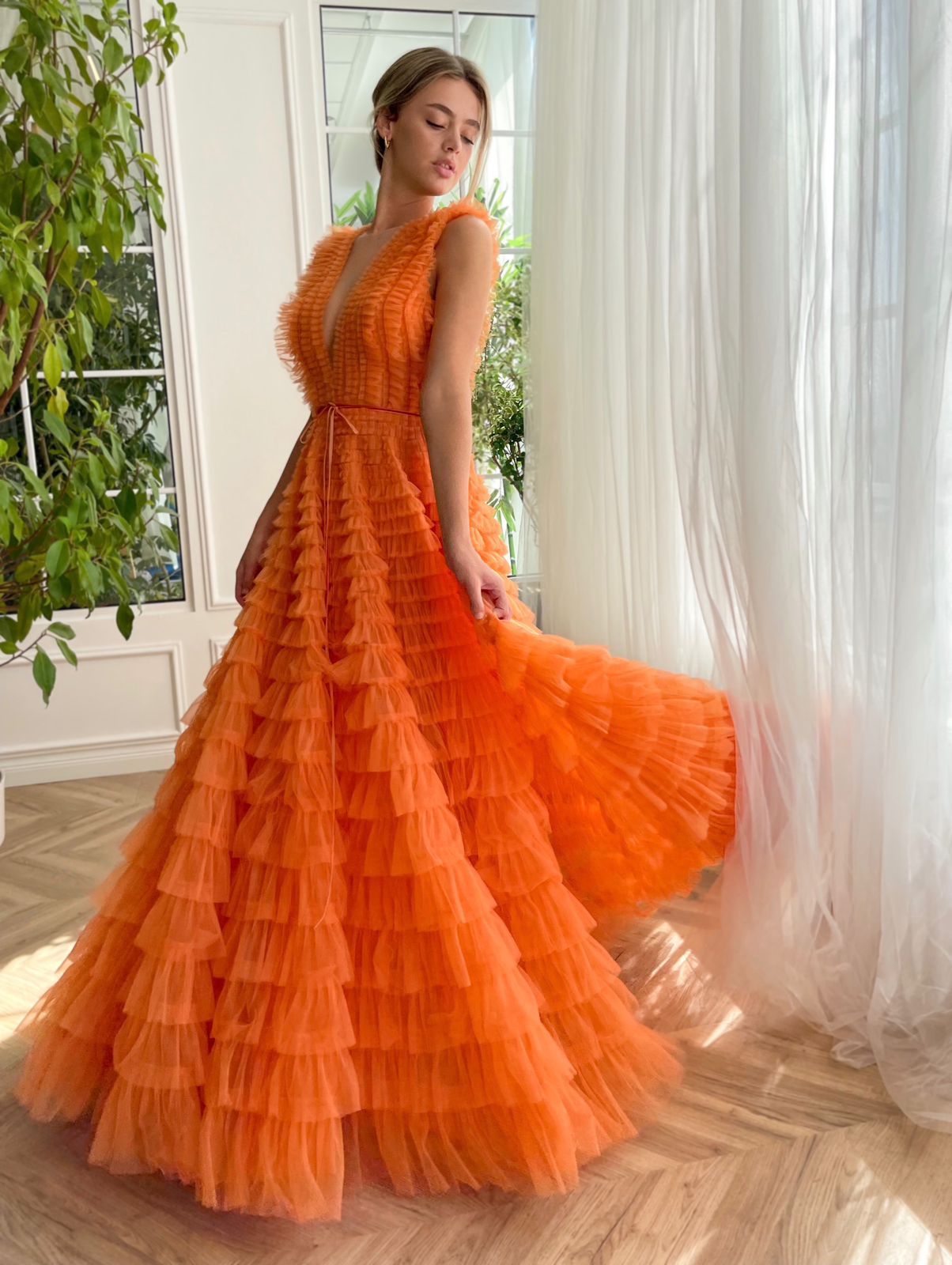 Orange A-Line dress with ruffles, no sleeves and v-neck