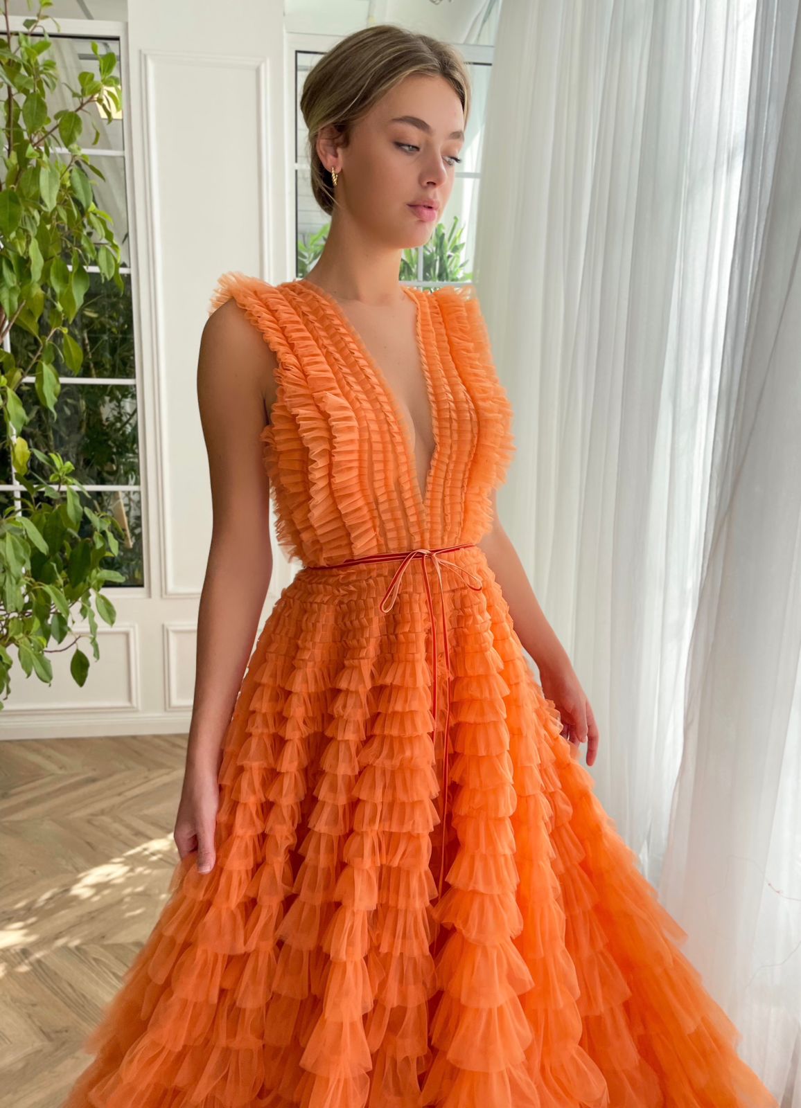 Orange A-Line dress with ruffles, no sleeves and v-neck