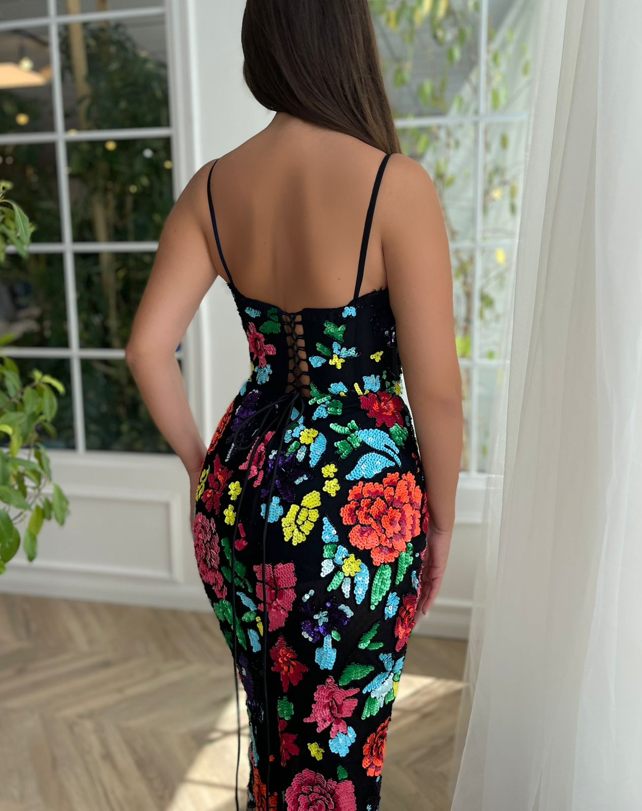 Black mermaid dress with colorful floral embroidery and spaghetti straps