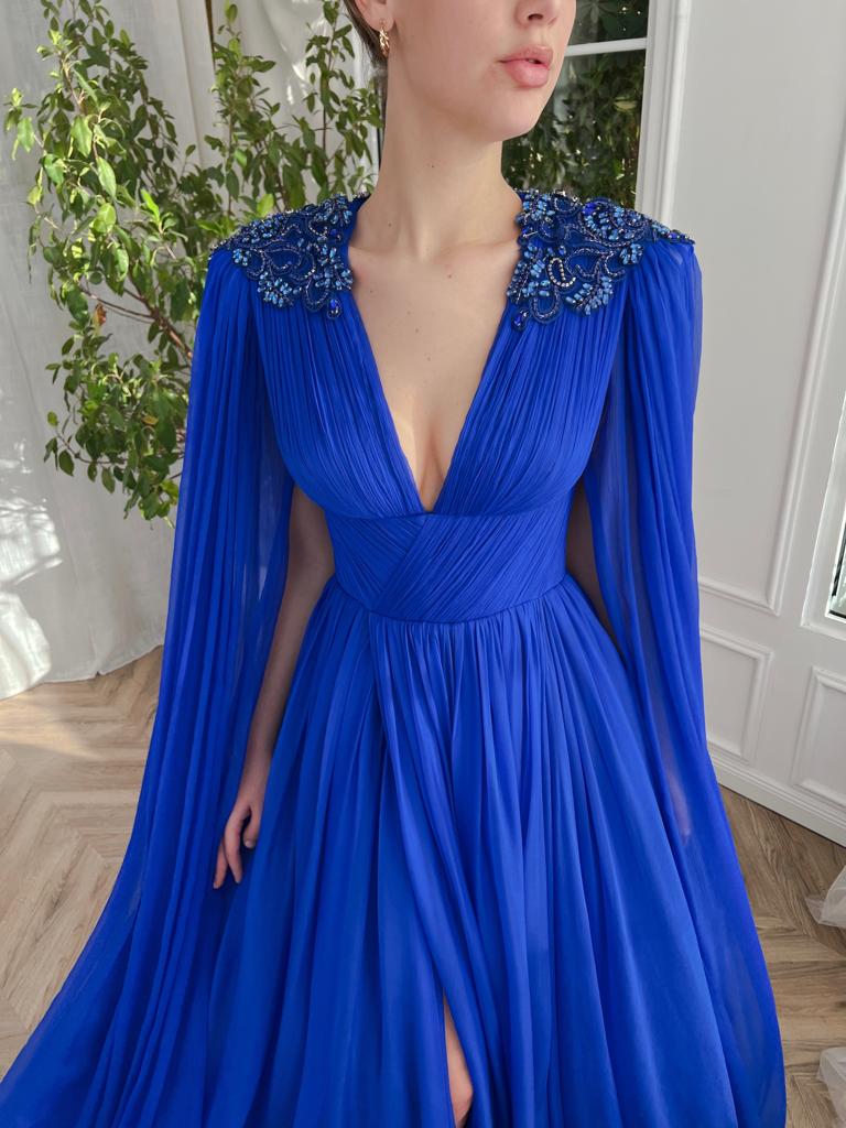 Blue A-Line dress with v-neck, drape, embroidery and cape sleeves