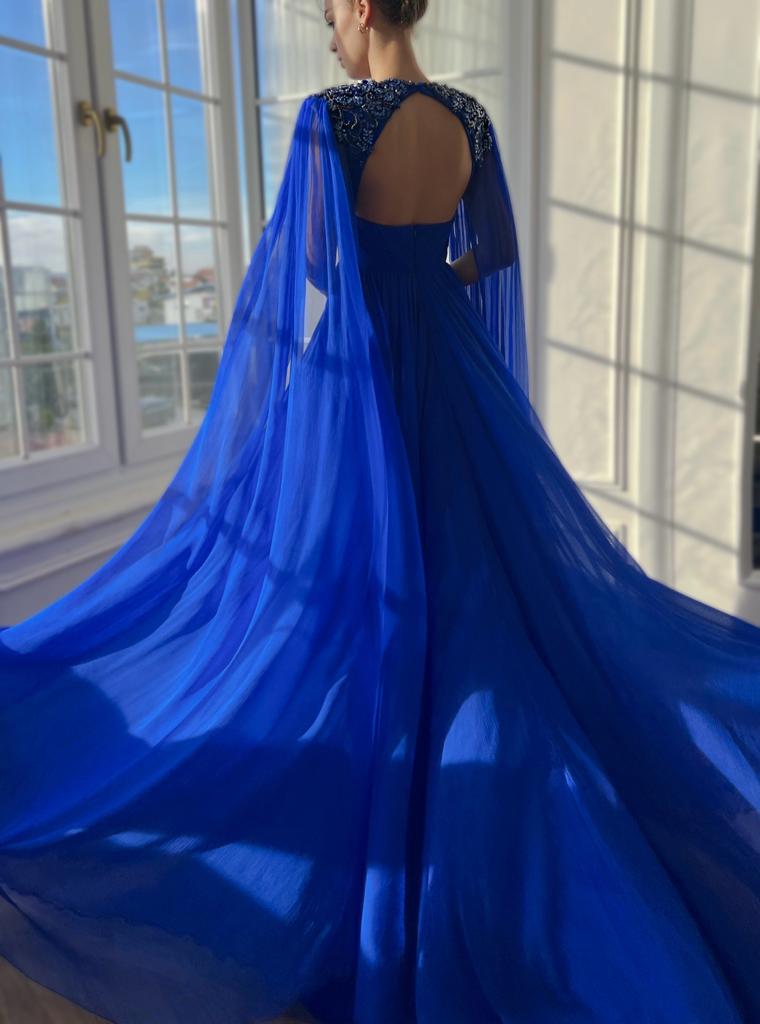 Blue A-Line dress with v-neck, drape, embroidery and cape sleeves