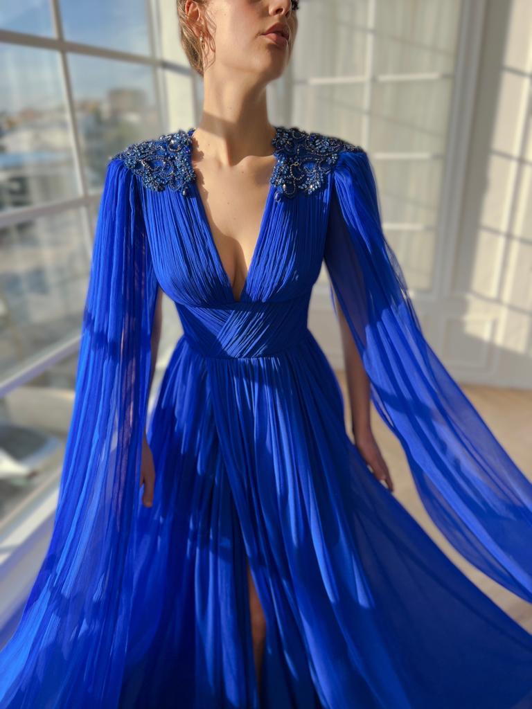 Blue A-Line dress with v-neck, drape, embroidery and cape sleeves