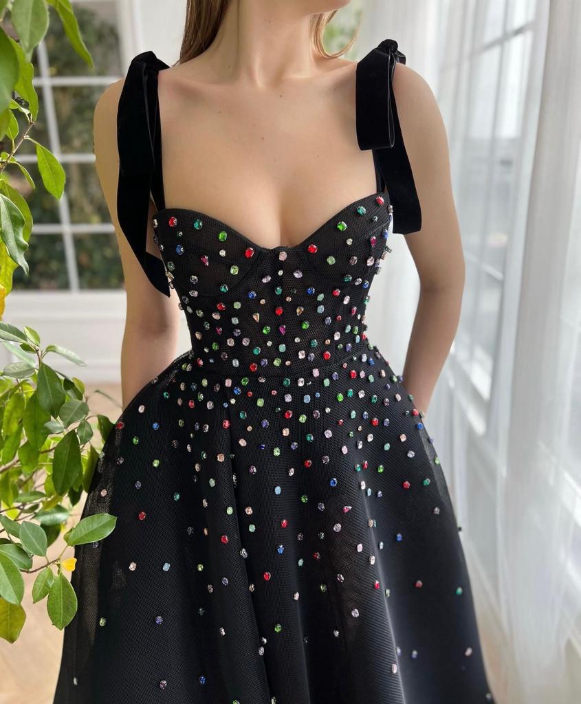 Black A-line dress with bow straps and embroidered jewels