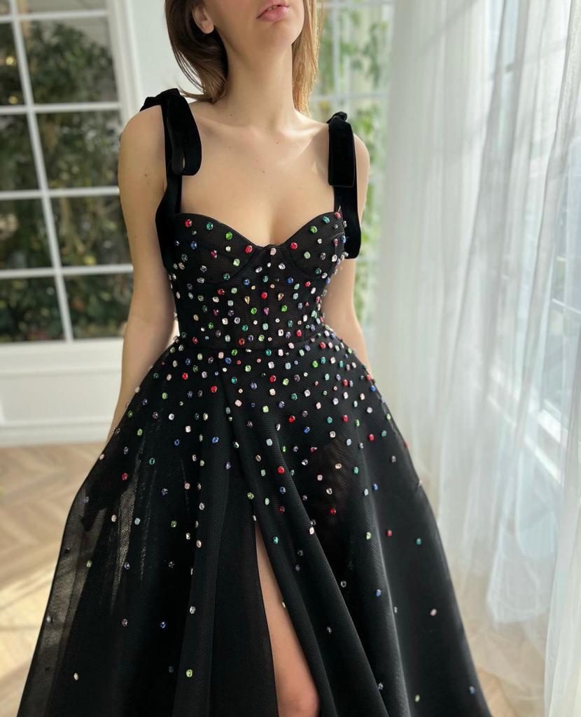 Black A-line dress with bow straps and embroidered jewels