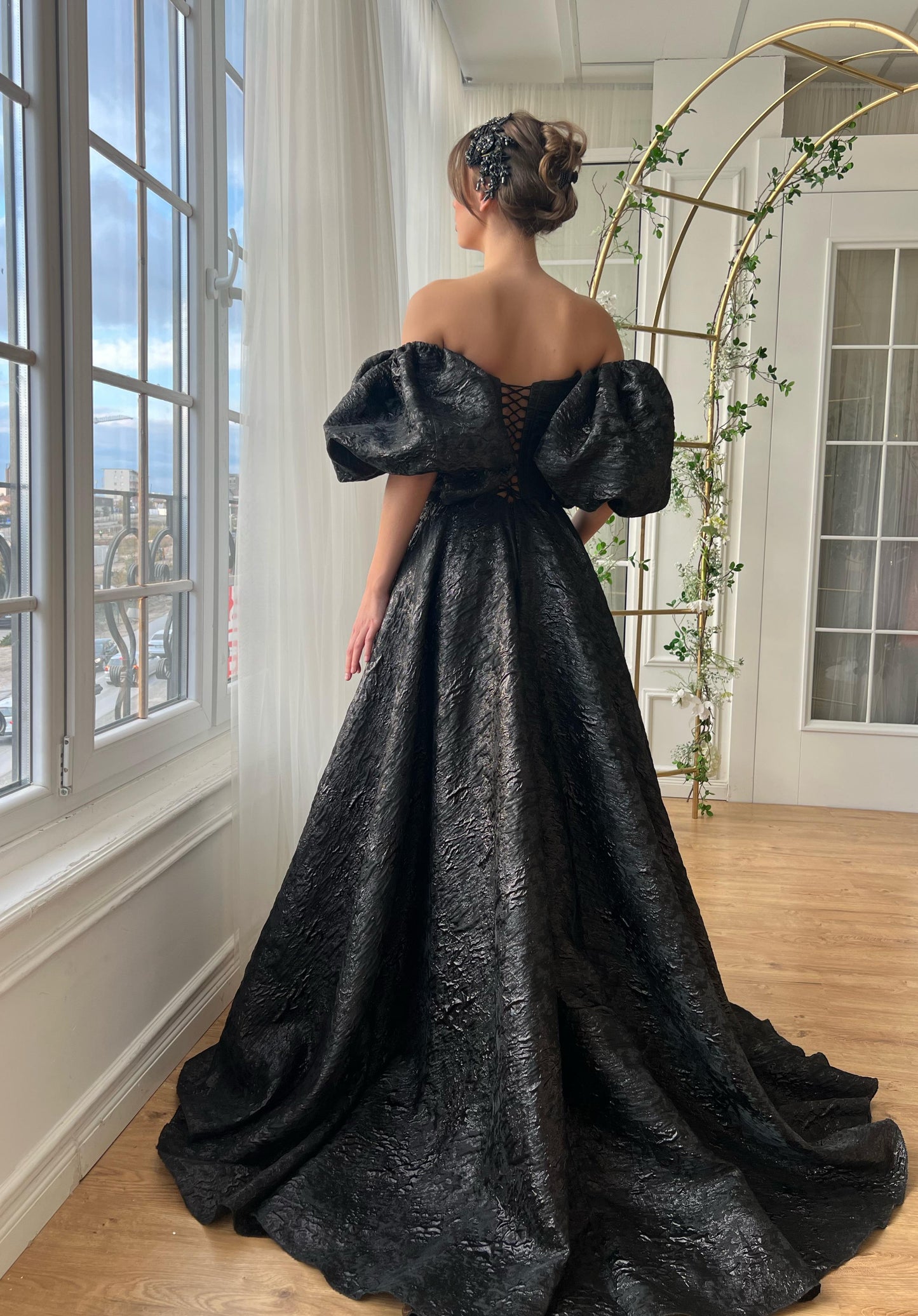 Black A-Line gown with short off the shoulder sleeves and brocade fabric