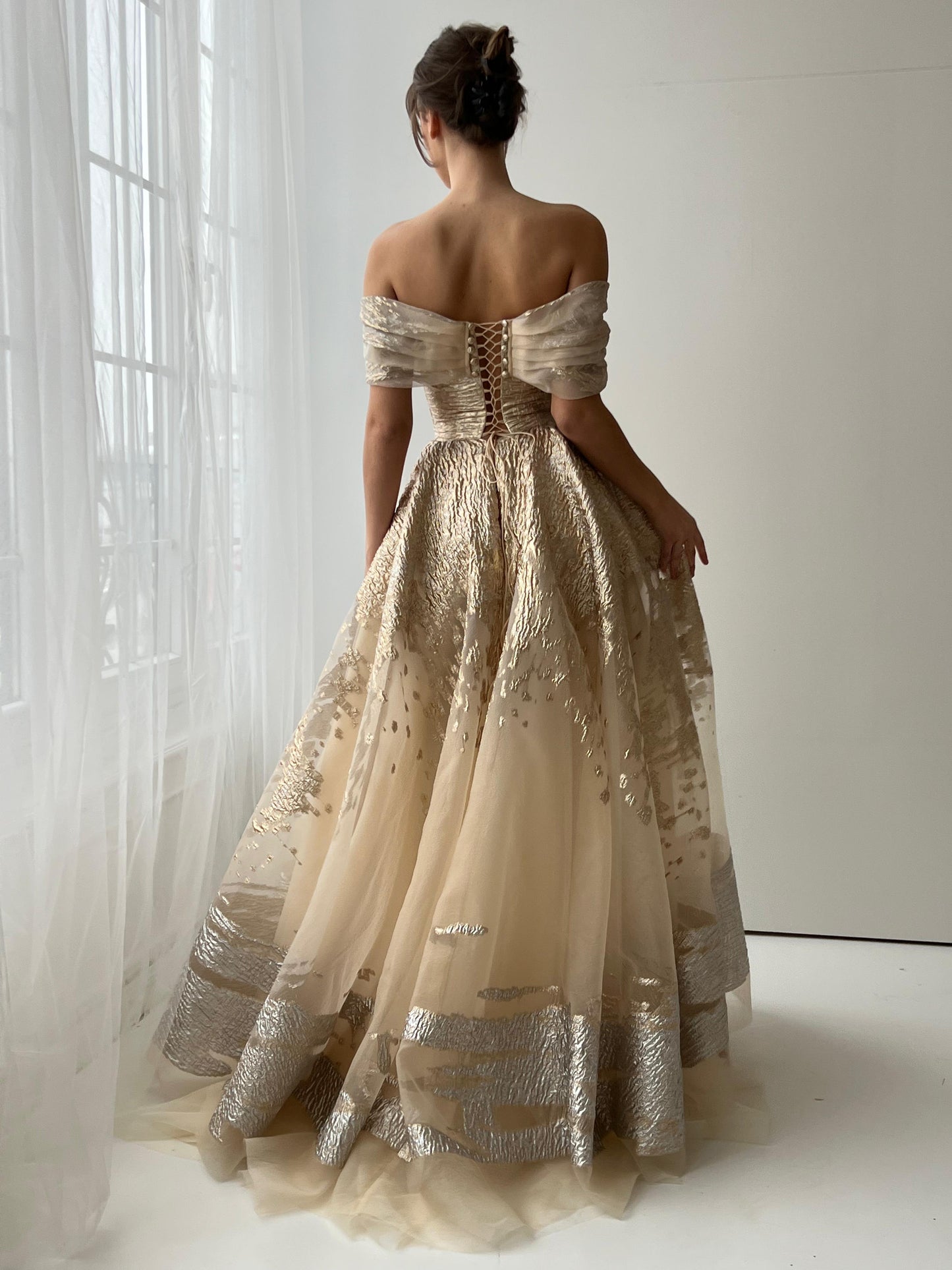 Beige A-Line dress with off the shoulder sleeves and brocade fabric