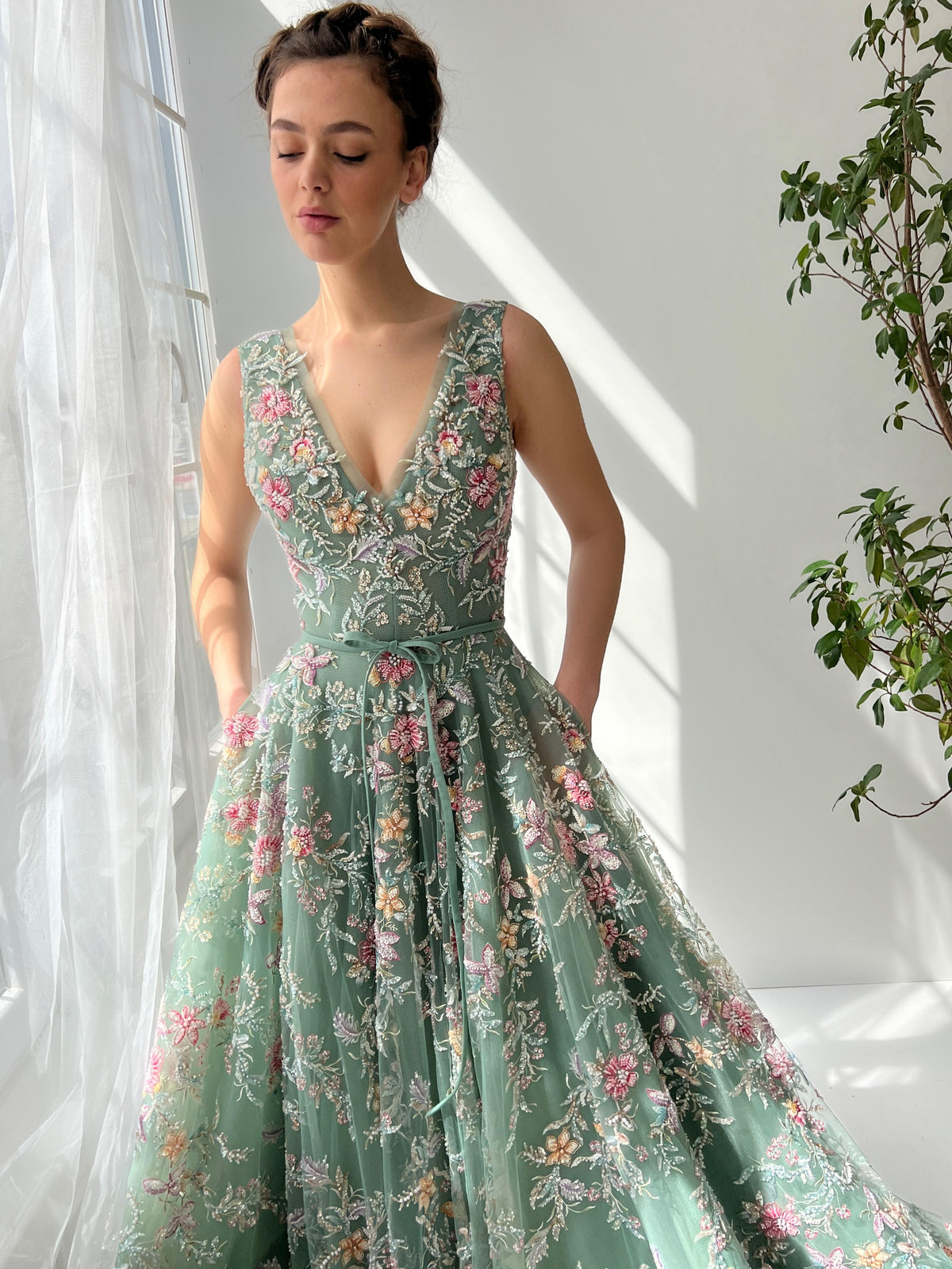 Green A-Line dress with v-neck, embroidery and no sleeves