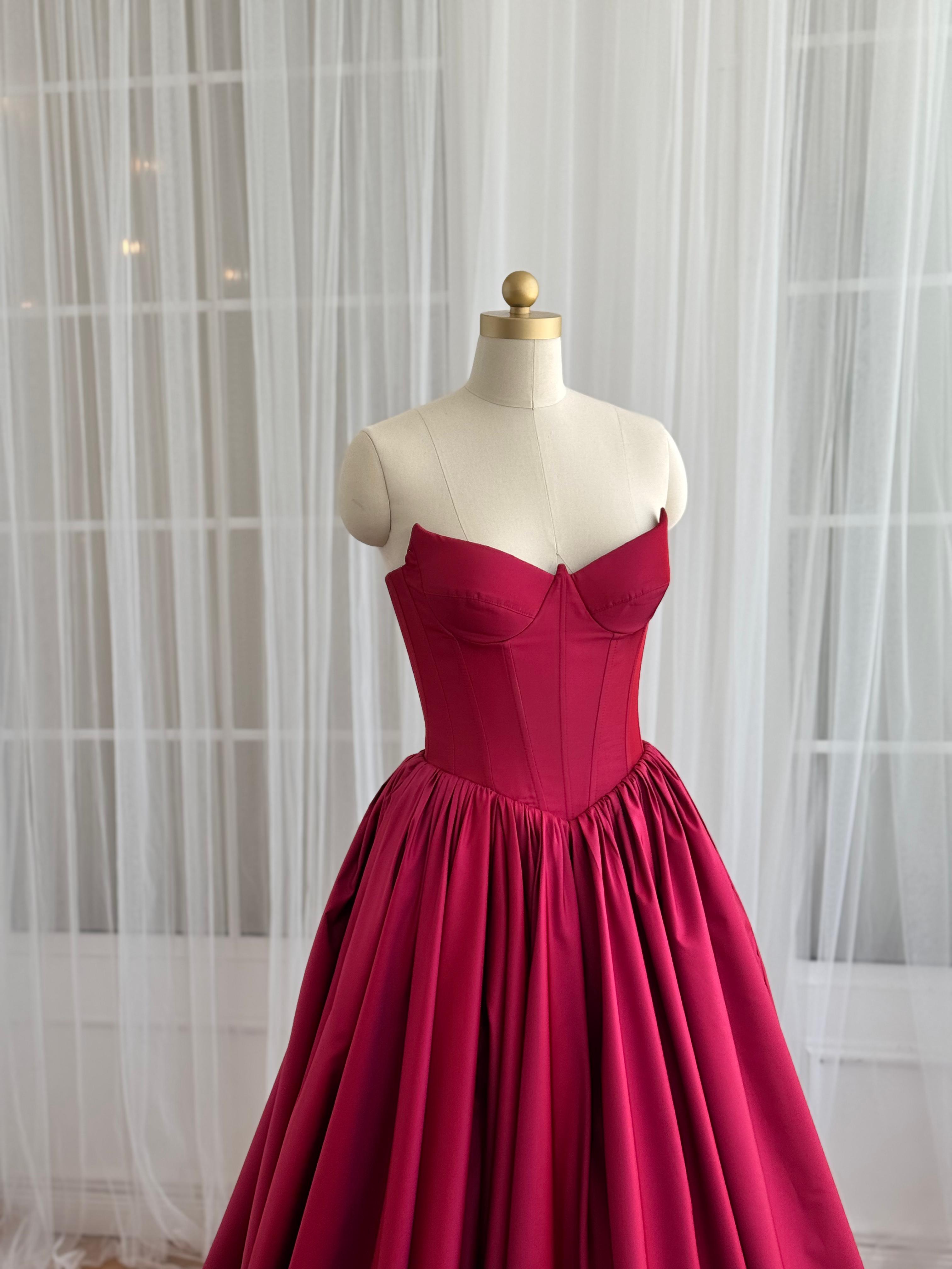 Red A-Line gown with no sleeves and taffeta fabric