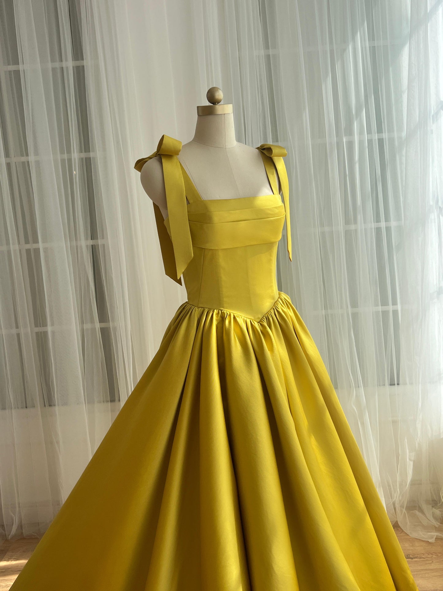 Yellow A-Line dress with bow straps and taffeta fabric